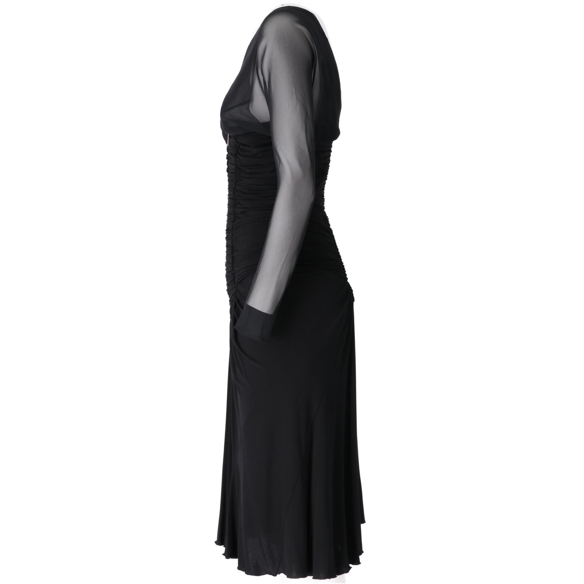 Roberto Cavalli V-neck black dress, long semi-transparent sleeves with semi-opaque inner lining, empire cut with decorative curls at abdomen height and wide skirt below the knee, zip closure on the back.

The item shows slight signs of wear on the