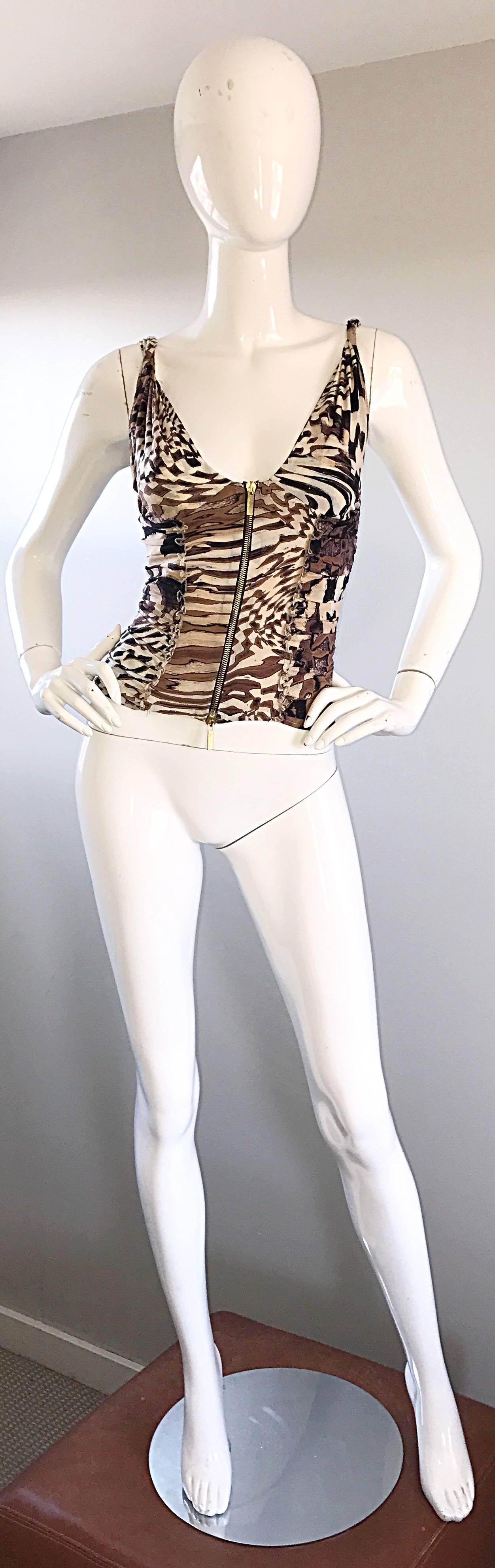 Sexy 1990s ROBERTO CAVALLI animal print silk bustier top! Features a full metal brass zipper up the front, so can be worn all the way up, or left partially open. Ruffle details on the front and back body. Asymmetrical animal zebra prints in brown,
