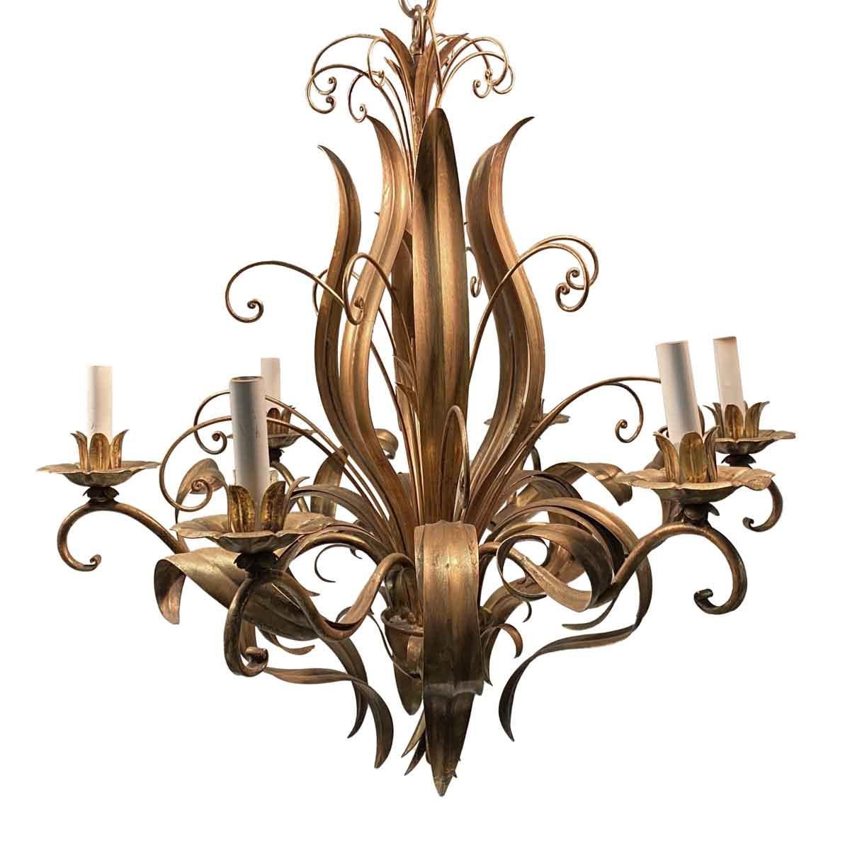 2000s gold leaf over brass Italian Florentine six-light chandelier featuring a filigree and floral bouquet. The lights are 60 w. max. This can be seen at our 333 West 52nd St location in the Theater District West of Manhattan.