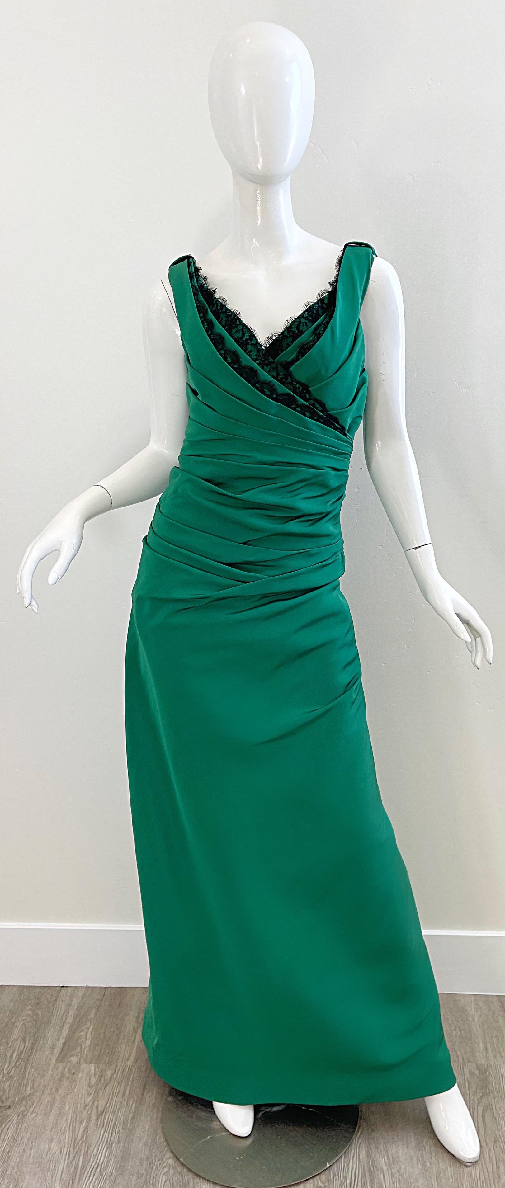Beautiful vintage 90s ROLAND NIVELAIS kelly green and black silk taffeta sleeveless couture evening gown ! Features a flattering ruched bodice with a dramatic train in the back. Black lace trim around the bust and train. Hidden zipper up the back