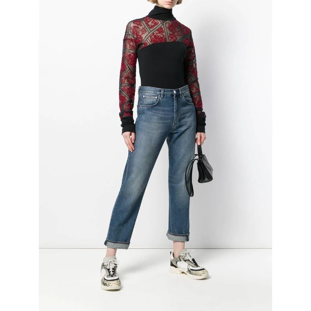Romeo Gigli blouse with semi-transparent details and red and grey embroidery. High collar, drop shoulder and long semi-transparent embroidered sleeves.

This item belongs to a deadstock, it has never been worn and comes with its original tag.
Years: