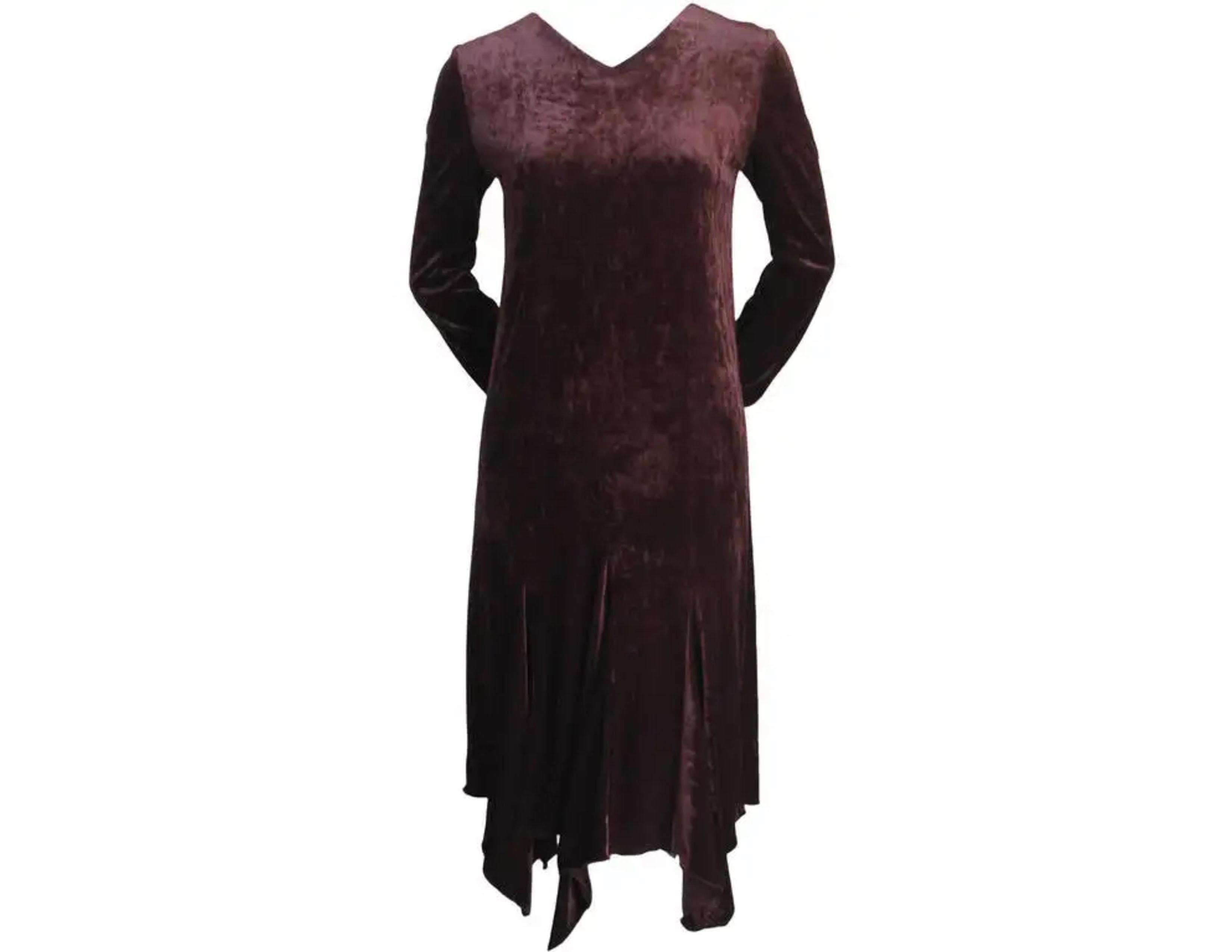 Brown velvet dress with v-neck and asymmetrical hemline from Romeo Gigli dating to the 1990's. Fits a size 6 or 8. Approximate measurements: shoulder 16