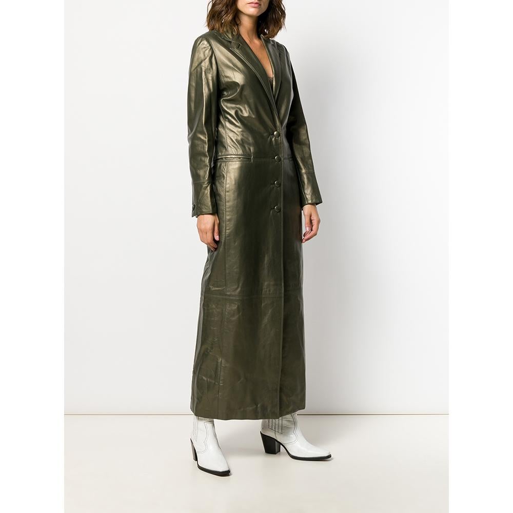 Romeo Gigli gold-tone khaki leather long coat. It features a classic lapel collar, buttons front fastening and front welt pockets. Fully lined.

Size: 40 IT

Linear measurements
Height: 138 cm
Bust: 40 cm
Shoulders: 36 cm
Sleeves: 61 cm

Product