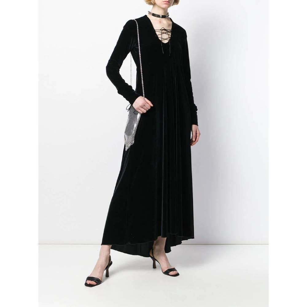 Romeo Gigli long asymmetric dress in black velvet. Model with U-neck and crossed laces. Long sleeves with laces and side zip closure.

Years: 90s 

Made in Italy 

Size: 44 IT

Flat measurements 

Height: 140 cm 
Bust: 43 cm
Shoulders: 48