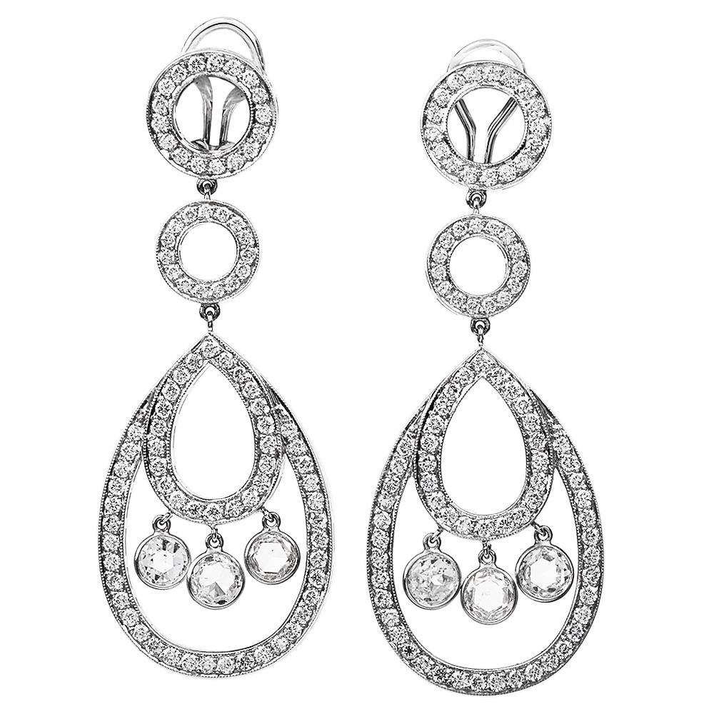 Modern Dangle Drop Earrings with full sparkle and dangle accents.

These lovely earrings are crafted in 18K white gold.

They feature a dance of round-cut white diamond paves set all over the piece, with approx. 180 round brilliant cut diamond, pave