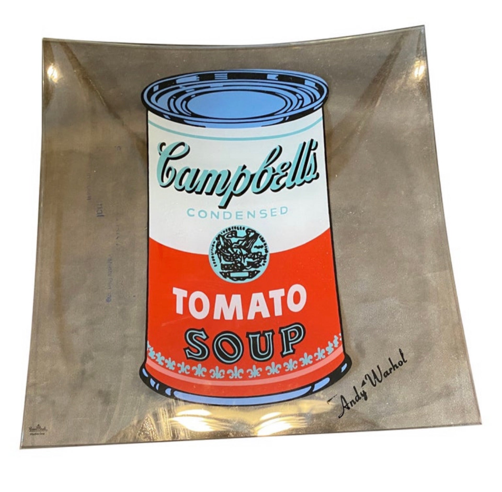The Rosenthal campbell soup glass small tray designed by Andy Warhol is a piece of pop art that captures the iconic imagery of the Campbell's Soup can in a functional and stylish manner. The tray is made  of high-quality glass, with a smooth and