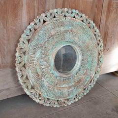1990s Round Mirror Carved in Wood with an Aged Finish