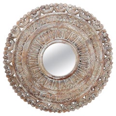1990s Round Mirror Carved in Wood with an Aged Finish