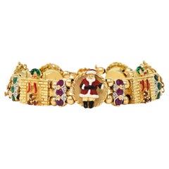 1990s Ruby Emerald Diamond Garnet Enamel 14 Karat Gold Christmas Slide Bracelet