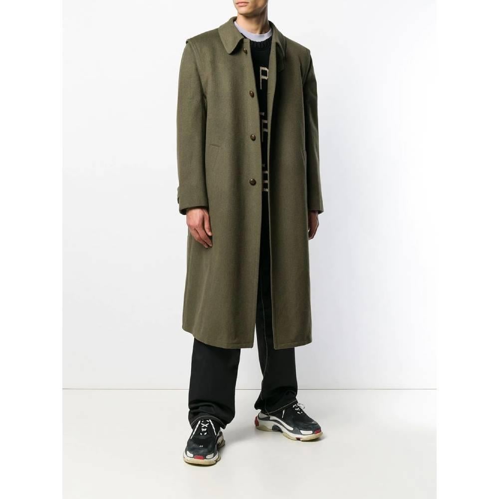 Loden Salko green herringbone wool coat with two front welt pockets, one inner zipped pocket, inverted pleat on back, classic collar, chinstrap, front closure with covered leather buttons and semi lined interior.

This item belongs to an original