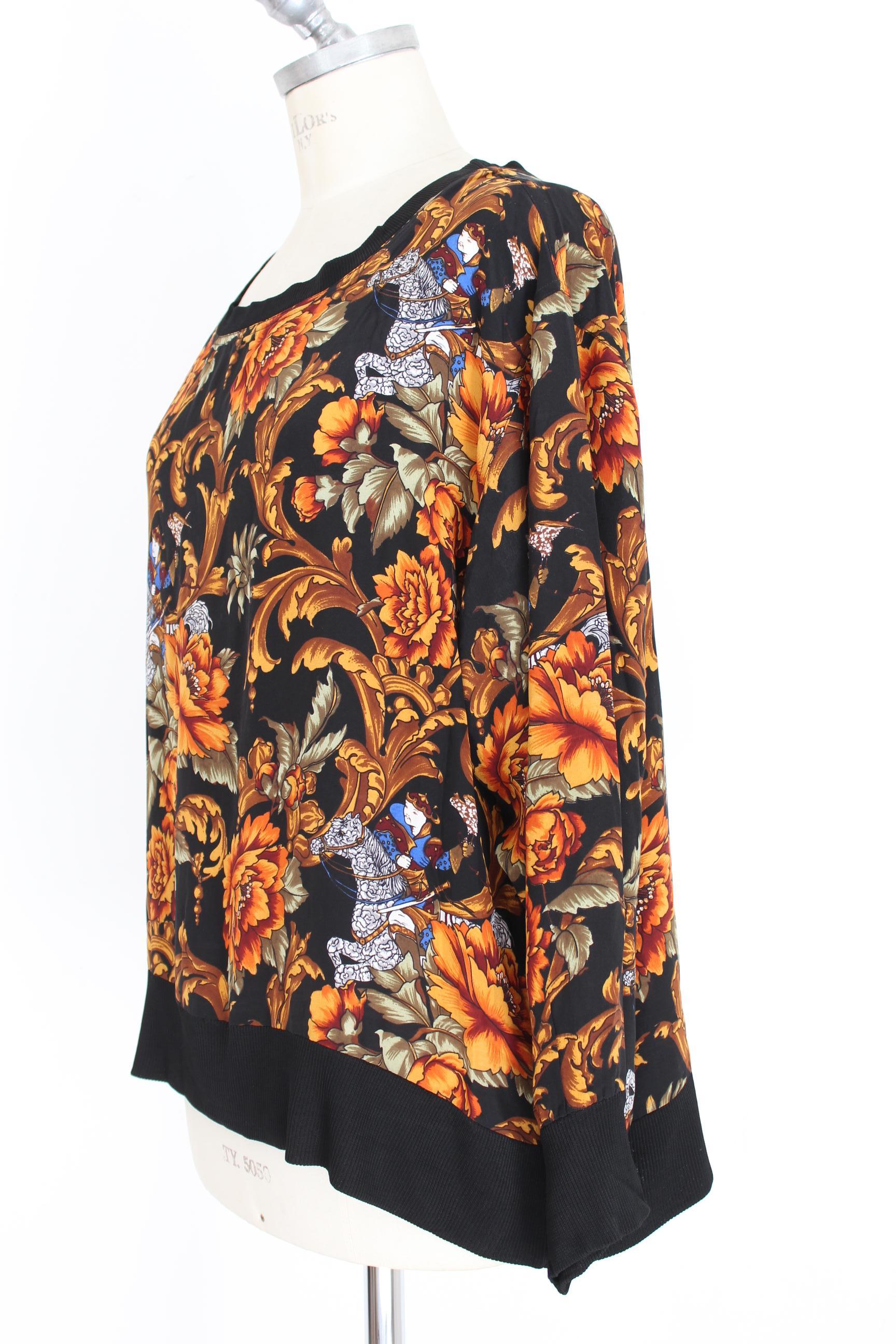 Salvatore Ferragamo 90s vintage women's shirt. Crewneck color black, wide sleeves, multicolor floral designs. 100% silk . Made in Italy. Excellent vintage conditions.



Size: 44 It 10 Us 12 Uk


Shoulder: 44 cm
Bust / Chest: 59 cm
Sleeve: 58