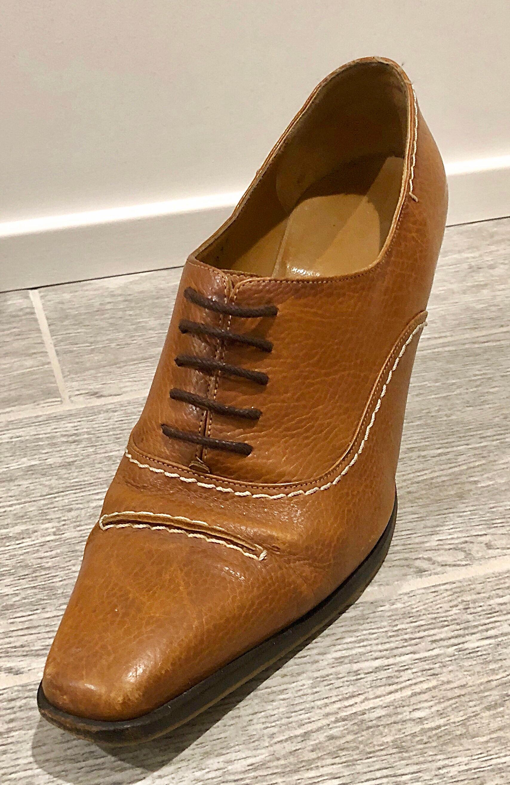 Insanely chic late 1990s SALVATORE FERRAGAMO saddle camel colored leather high heel lace up oxford booties! The perfect color that matches anything, and is great all year. Can easily be dressed up or down. Great with jeans, shorts, a skirt or dress.