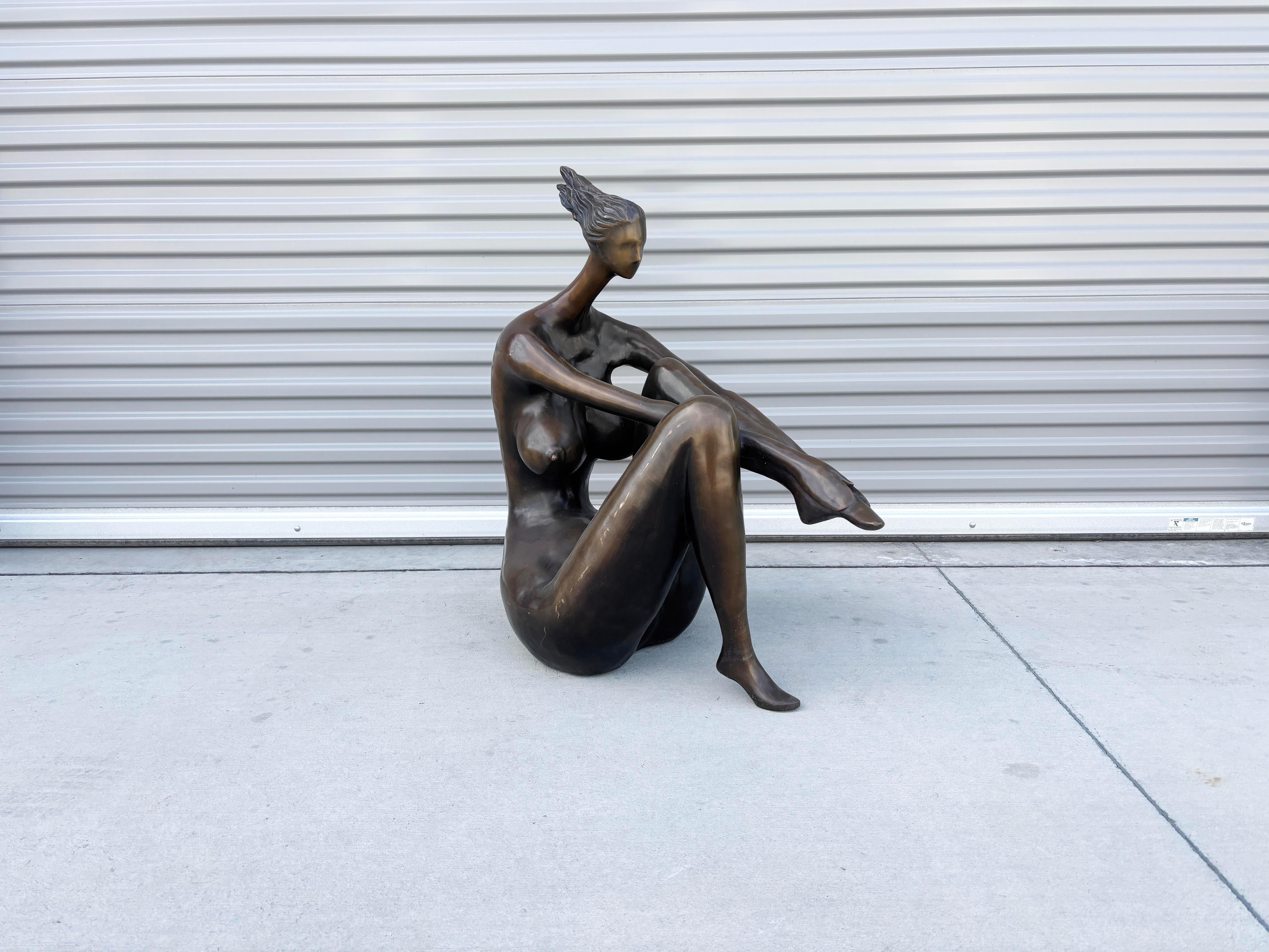 ✨ Vintage 1990s Bronze Seated Female Sculpture ✨

Crafted in the United States during the 1990s, this elegant bronze sculpture captures a seated female figure in a moment of quiet introspection. Rendered in a modernist style, the piece features