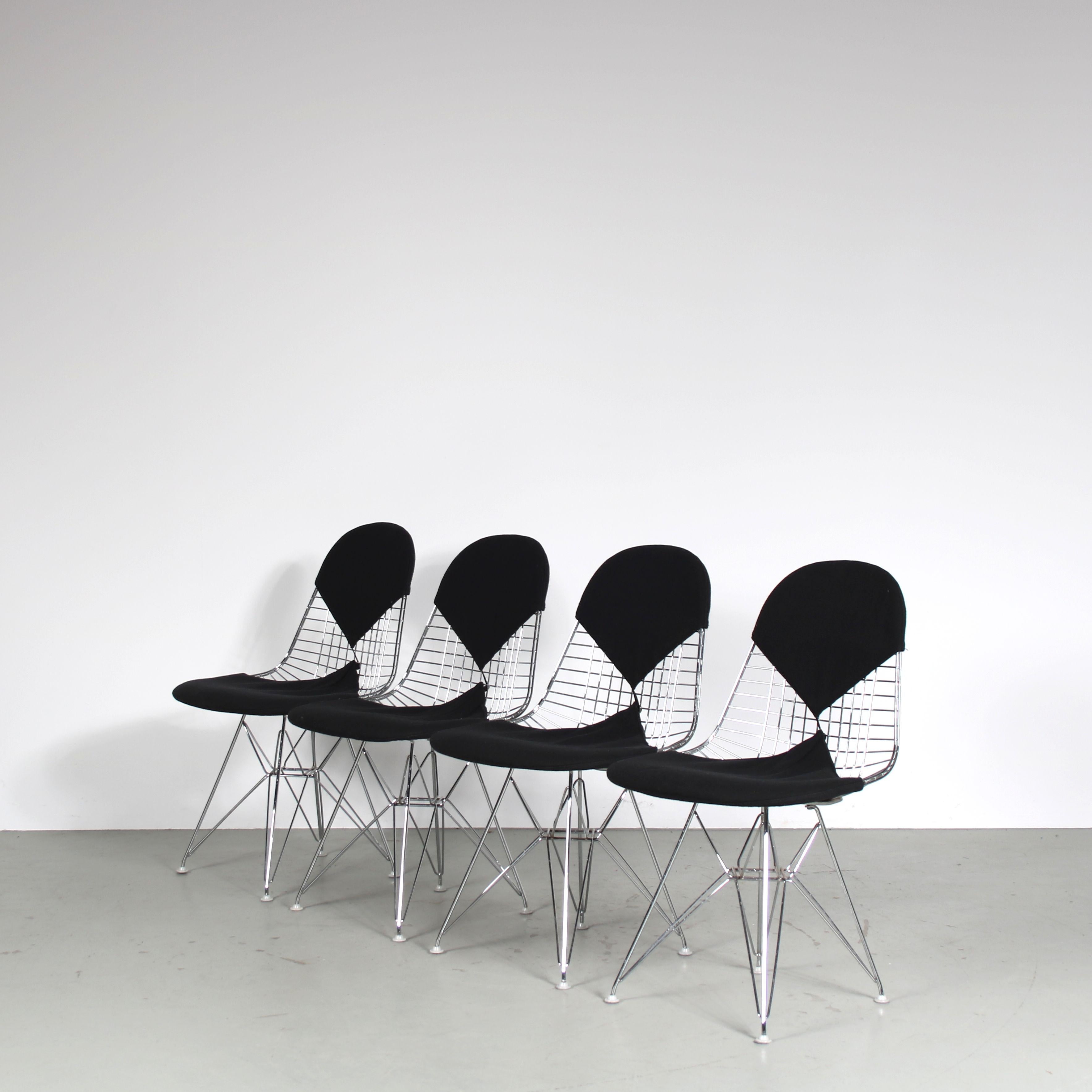 

This set of four dining chairs, also known as the “Bikini” chairs, was designed by the iconic design duo Charles and Ray Eames in the 1950s. This particular set is a later 1990s production by Vitra in Germany, featuring chrome wire metal frames