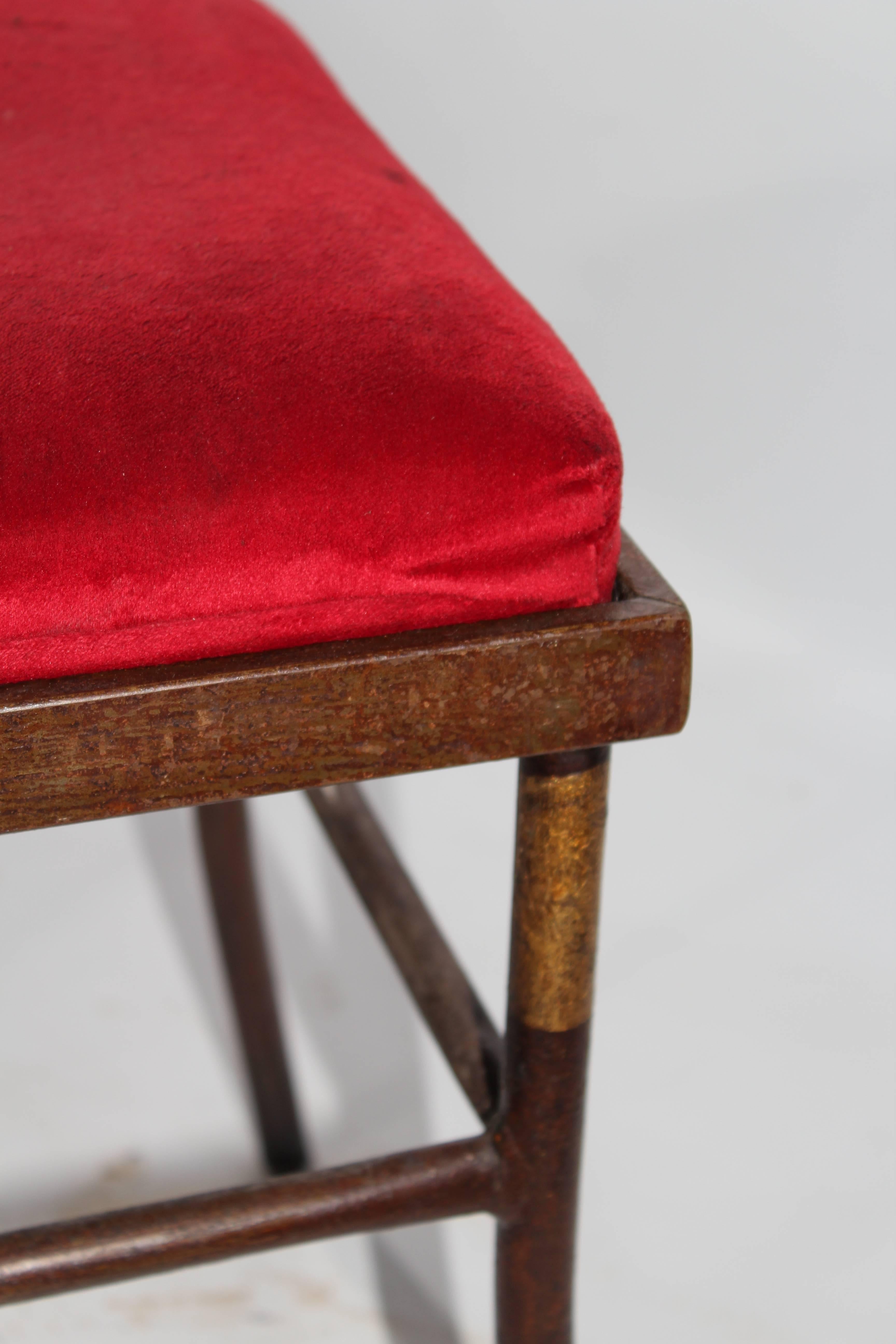 Set of four 1990s iron stools upholstered in red velvet.

