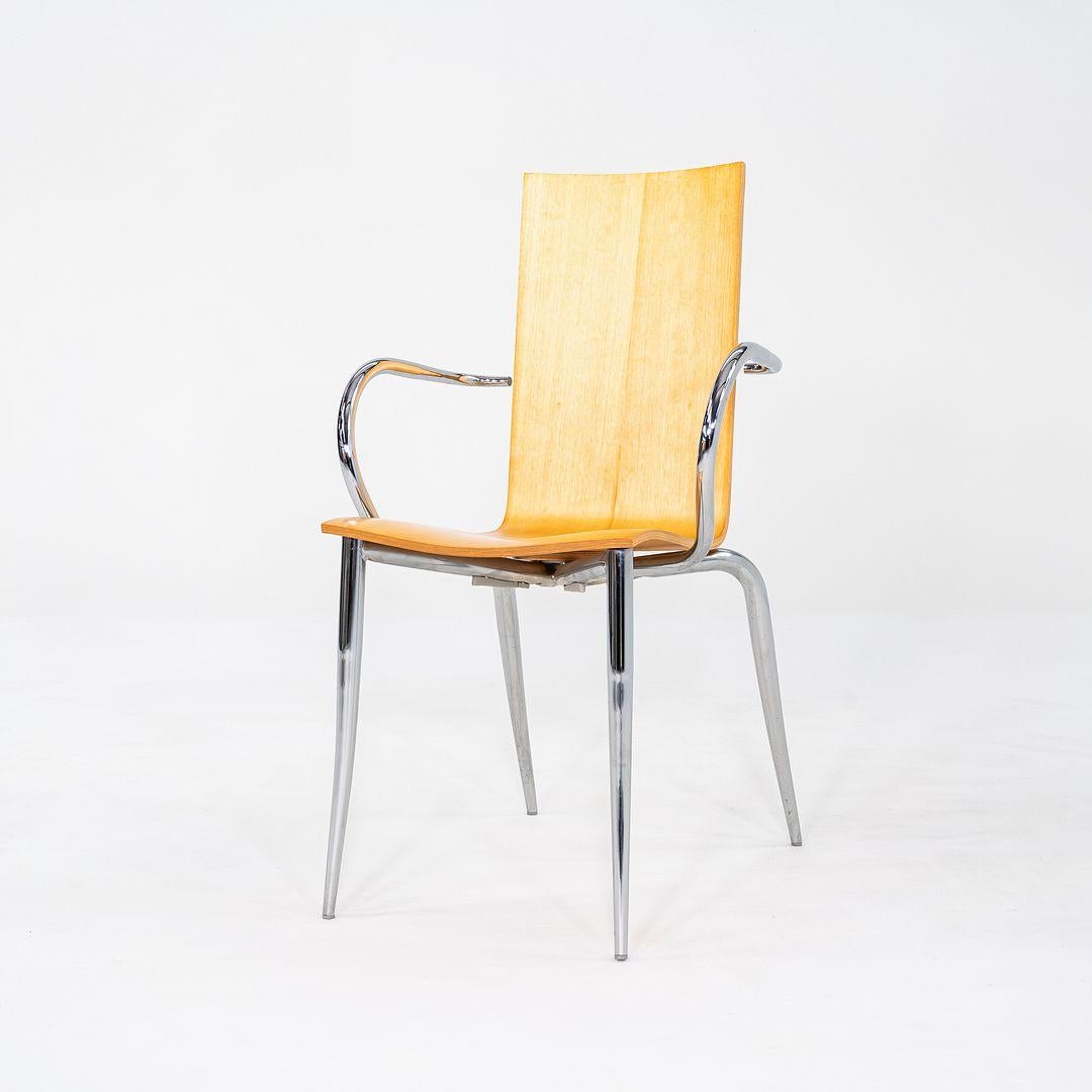 This is a set of six Olly Tango Dining Arm Chairs, originally designed by Philippe Starck in 1993. These particular examples were produced by Driade in Italy and date to the 1990s. Their design features chrome-plated steel legs and armrests with a