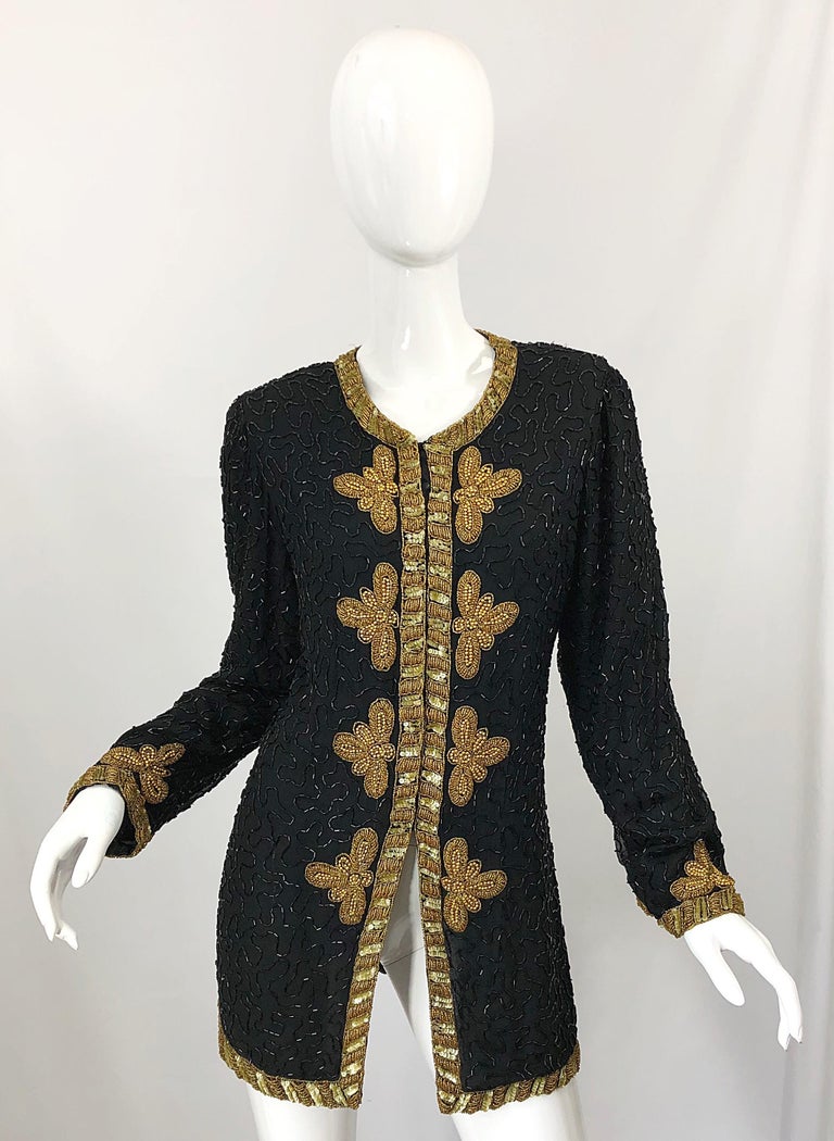 Beautiful 1990s Size Large black and gold silk chiffon beaded jacket! Features thousands of hand-sewn black and gold beads and sequins throughout. Hook-and-eye closures up the front. Multiple layers of soft black silk chiffon. Can easily be dressed