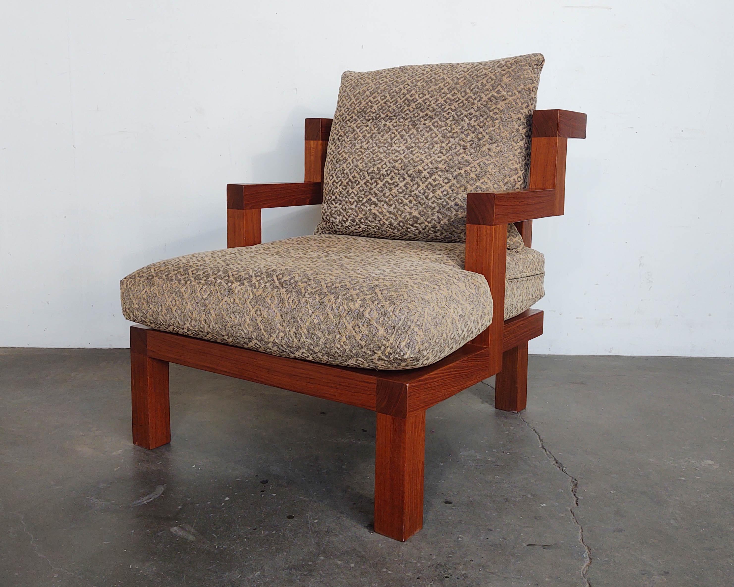 Beautiful handmade solid teak wood chair with stair-step arms by Alwy Visschedyk. Excellent craftsmanship with no visible hardware and lovely joinery. This design offers intrigue at every angle. Down-filled cushions have original upholstery. Some