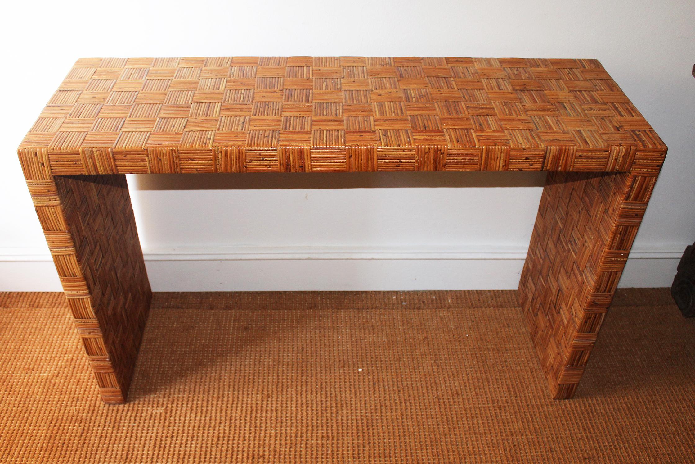 1990s Spanish simple and elegant console table using laced wicker in crisscross pattern.