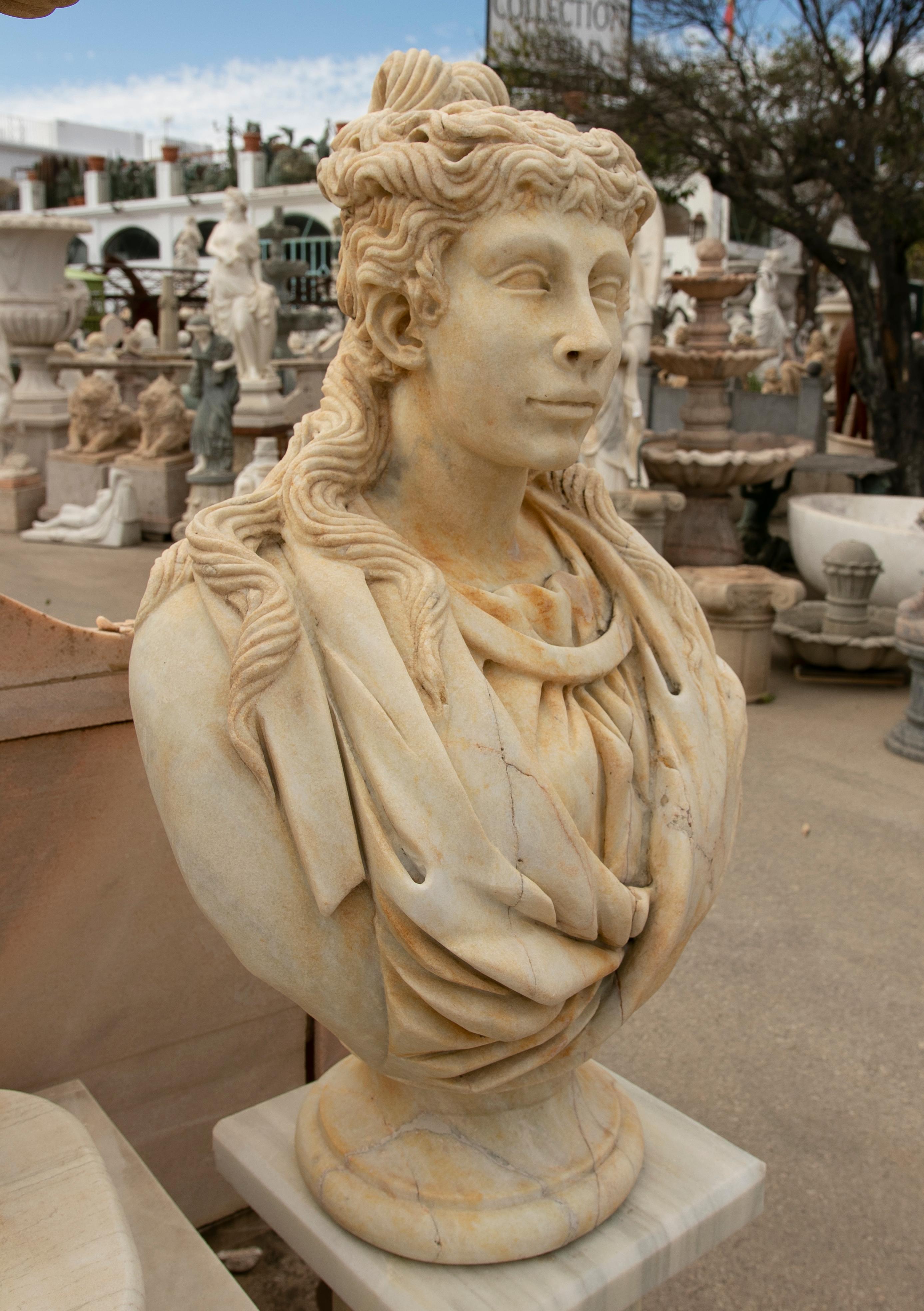 Hand-Carved 1990s Spanish Hand Carved Aged Macael White Marble Bust of Roman Woman w/ Stola For Sale