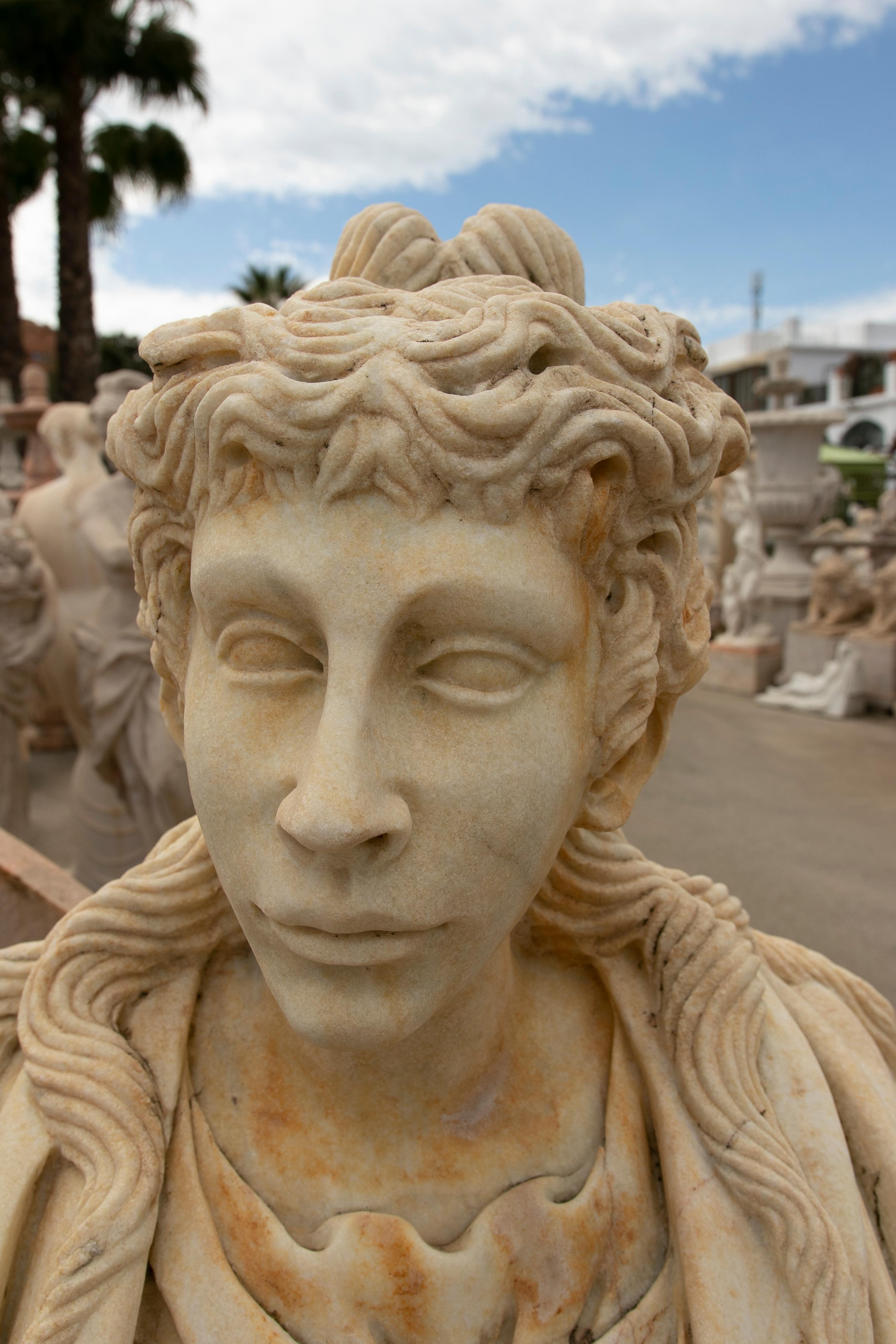 20th Century 1990s Spanish Hand Carved Aged Macael White Marble Bust of Roman Woman w/ Stola For Sale
