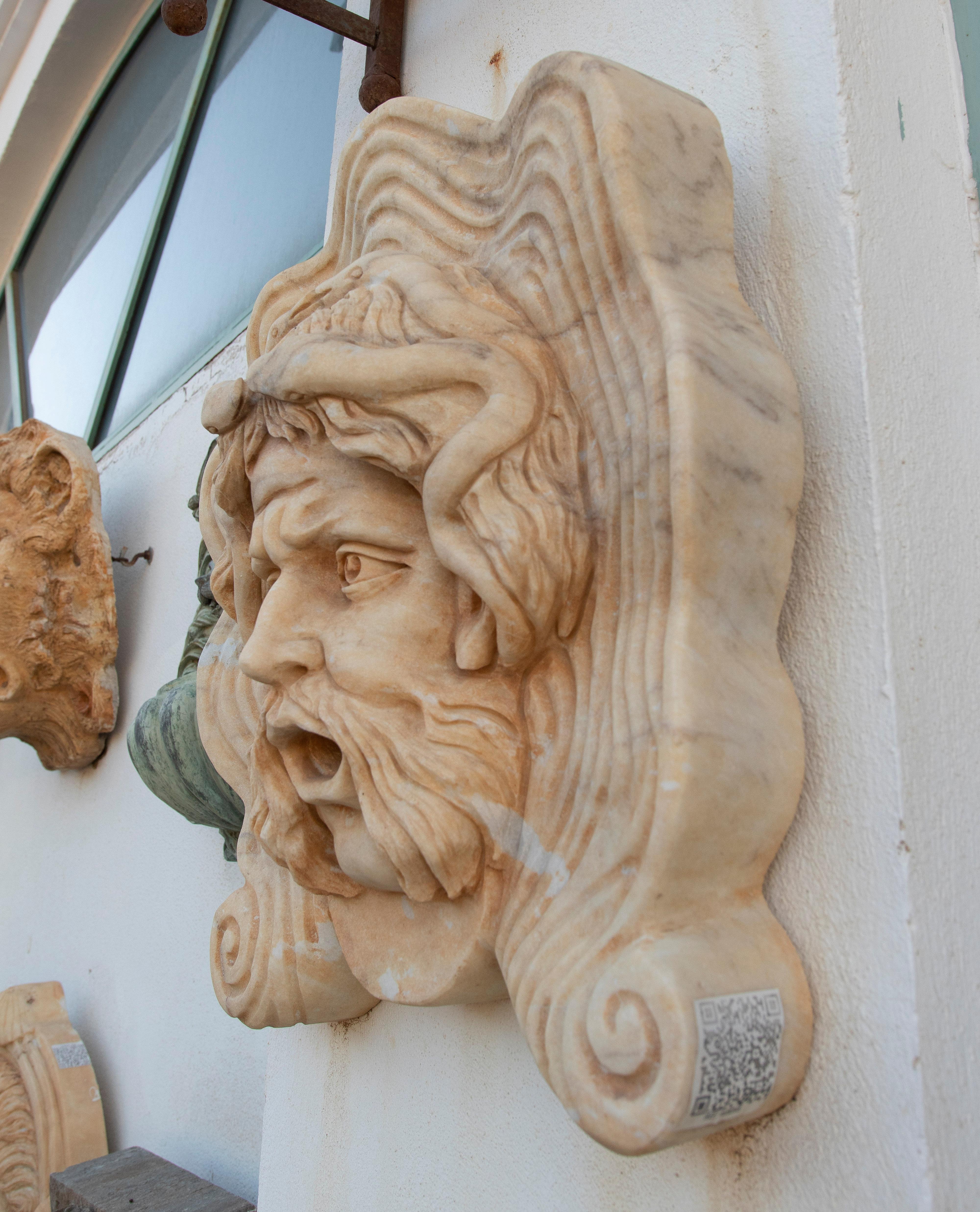 Classical 1990s Spanish hand carved aged Macael white marble mascaron of Roman male Medusa. 

Ideal as a water spout in a wall fountain setup.
 