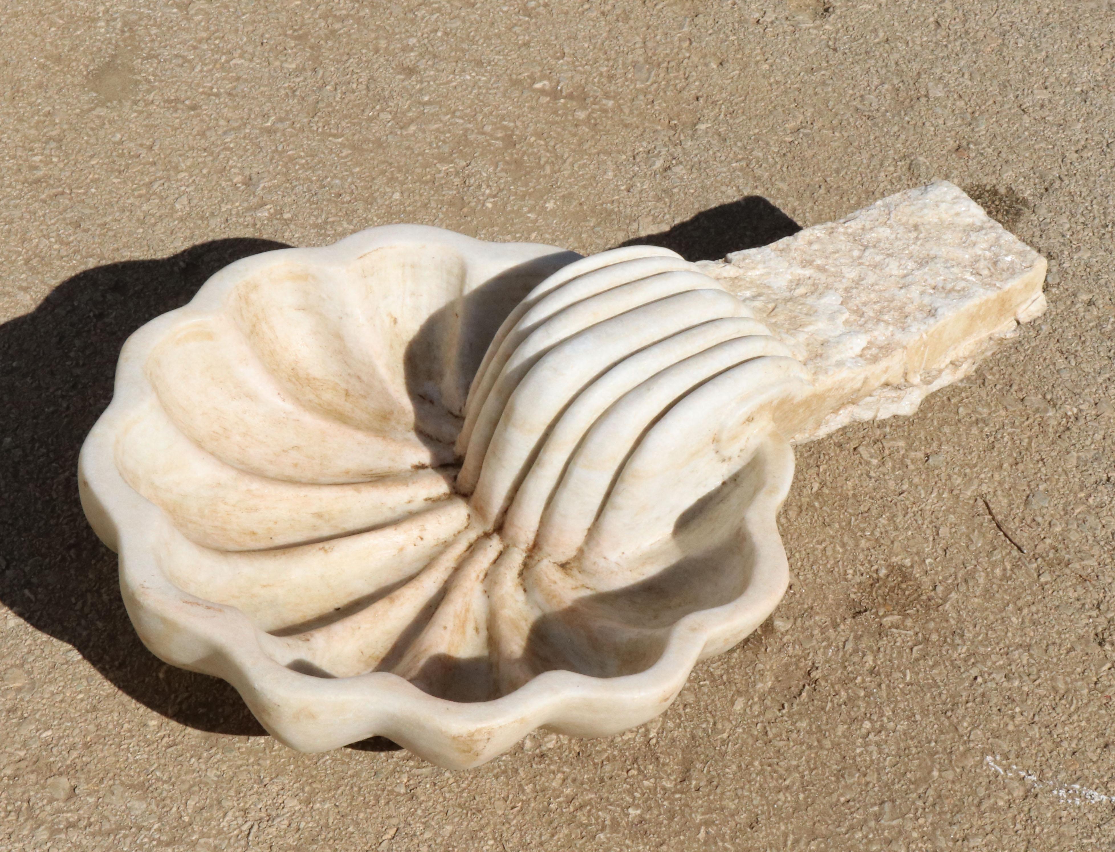 1990s Spanish hand carved aged white marble seashell, ready to be fixed to the wall and used as a wall fountain or for decoration.