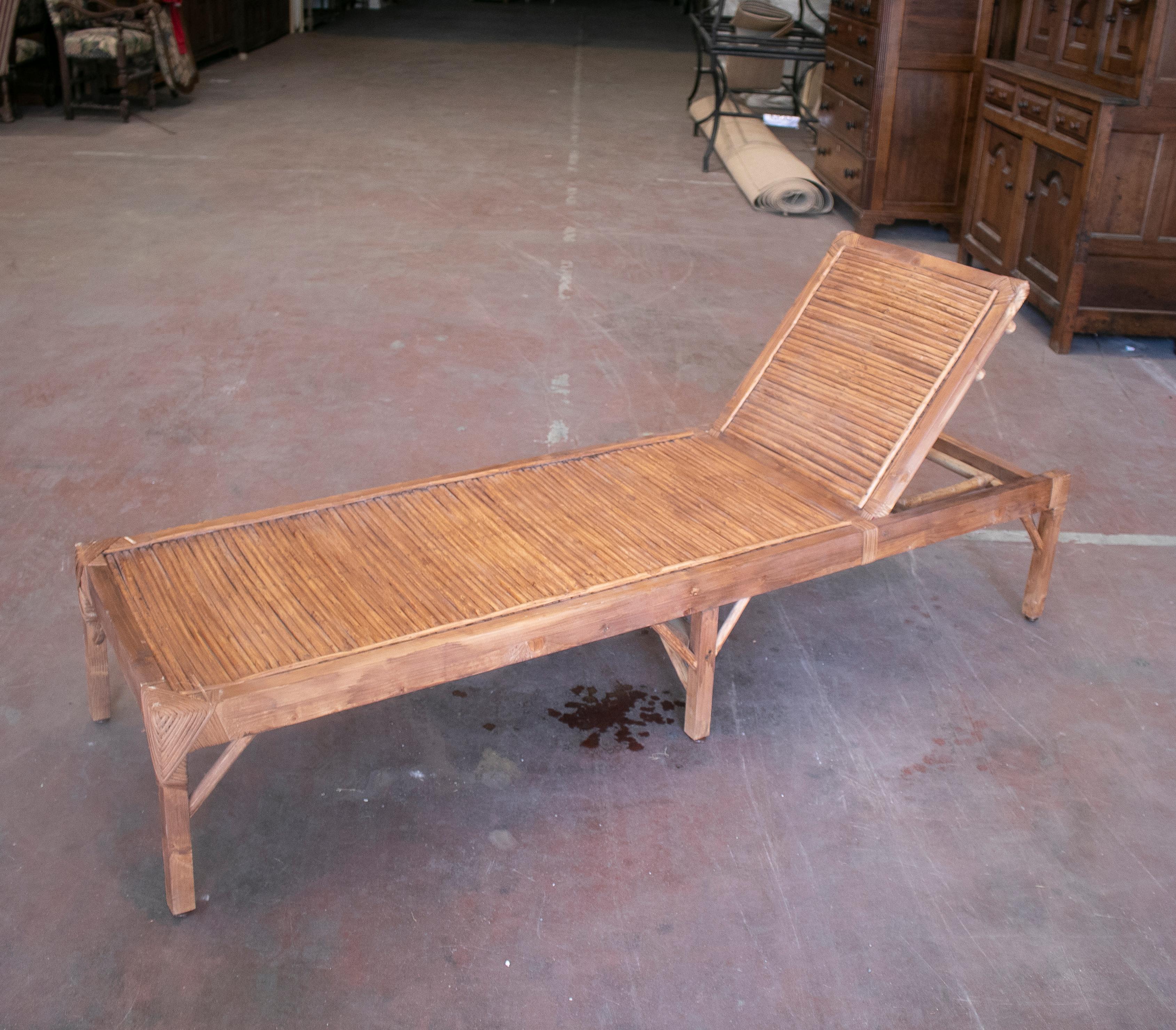 Vintage 1990s Spanish pair of bamboo and woven wicker swimming pool deck chairs.