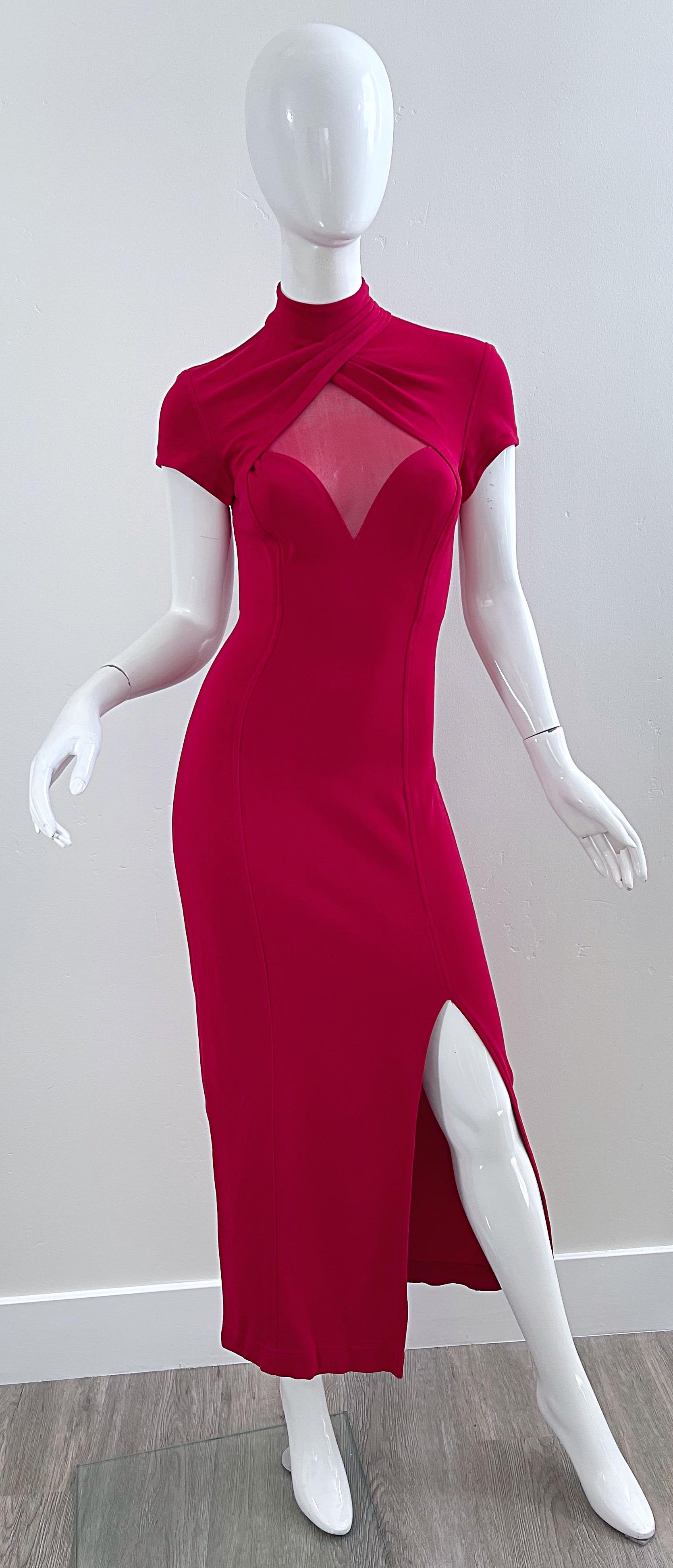 Sexy 1990 TADASHI lipstick red cut-out jersey bodcon gown ! Features peek-a-boo detail at bodice with red sheer mesh. Matching cut-out on the back. Hidden zipper up the back with hook-and-eye closure. Slit at the left hem reveals just the right