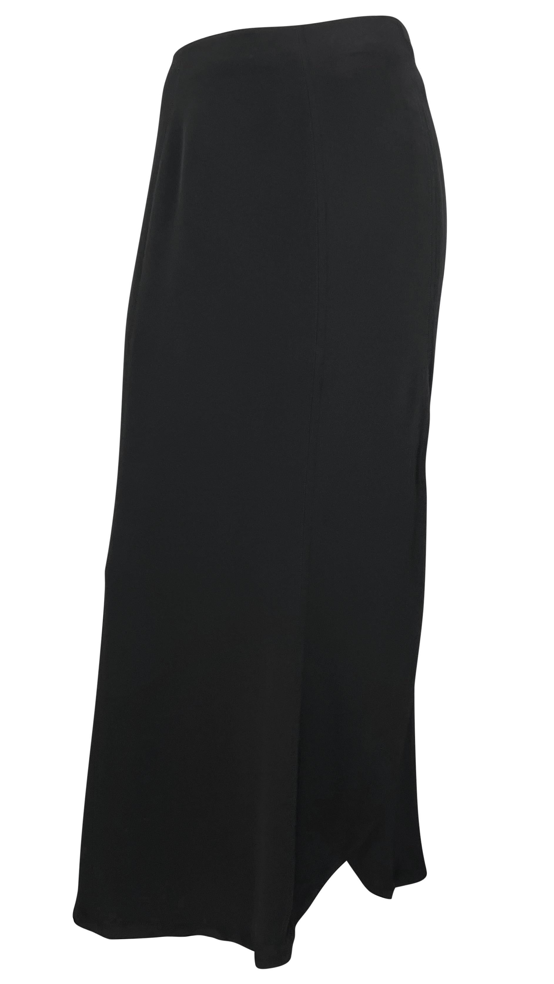 From the 1990s, this black Thierry Mugler maxi faux wrap style skirt is an elevated closet essential. Effortlessly chic with a slightly high waist, this skirt's hem falls just above the ankles. 

Approximate measurements:
Size - 40FR
Waistband to