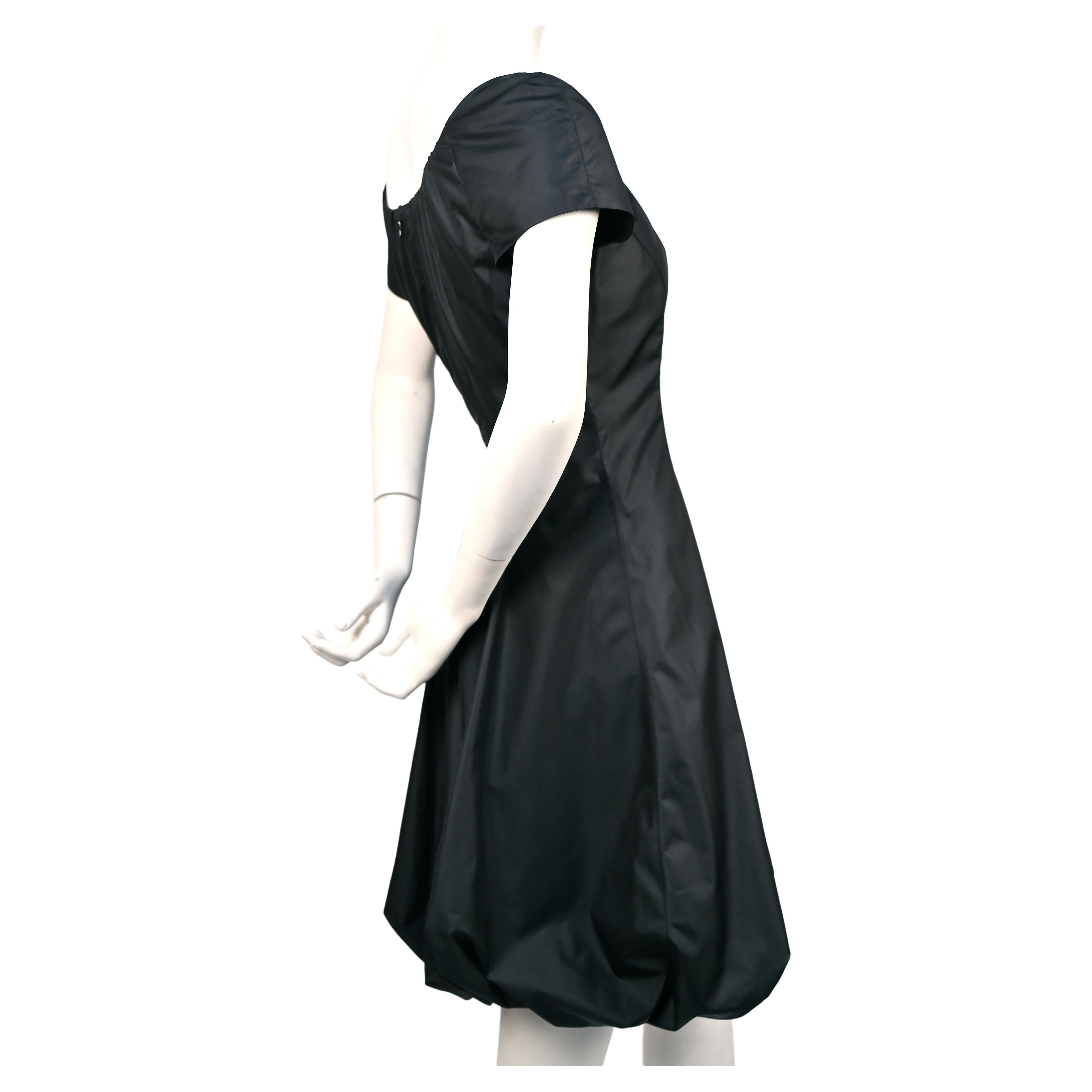 Jet-black, silk dress with gathered neckline and bubble hemline from Thierry Mugler dating to the 1990's. Labeled French size 38, which best fits a US 4 or 6. Dress measures approximately: 36
