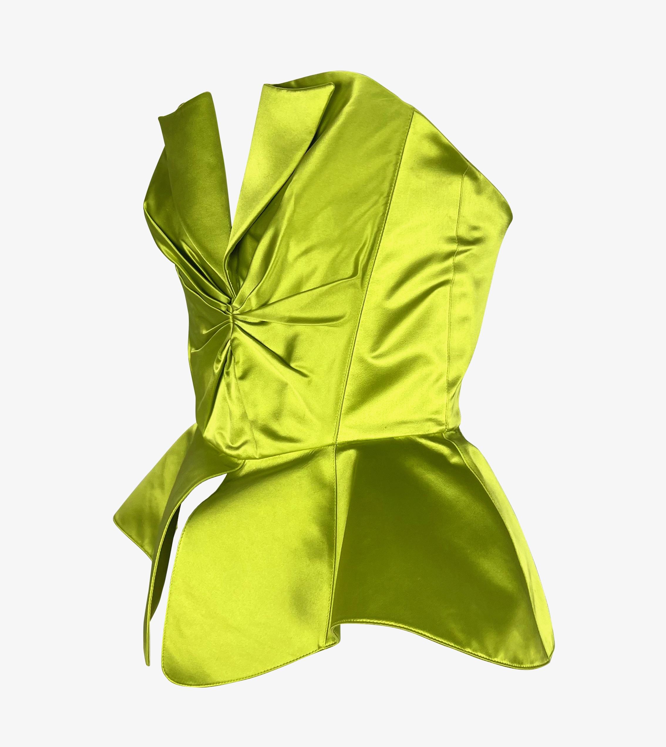 Presenting a chartreuse Thierry Mugler silk satin corset. This absolutely incredible silk corset features a cinched waist and an architectural peplum design. From 1995, this sleeveless strapless top features a v-neckline and lapel-style flaps. The