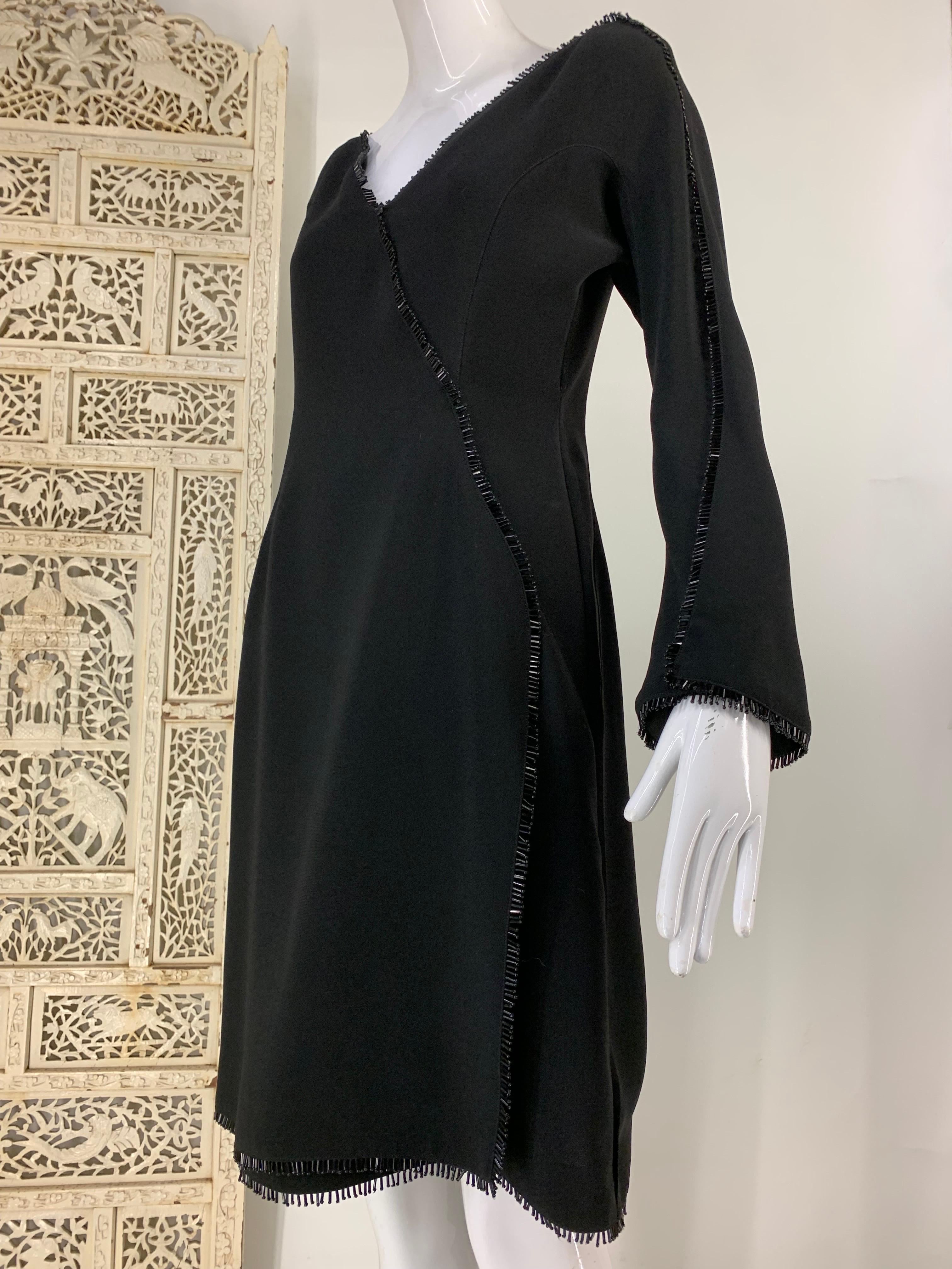 1990s Thierry Mugler Fit & Flare Wrap Style Black Cocktail Dress w Bead Fringe: Bugle beaded fringe edgework with bell shaped sleeves. Tailored rounded shoulders and 40s-inspired silhouette. Marked EU size 38. 
