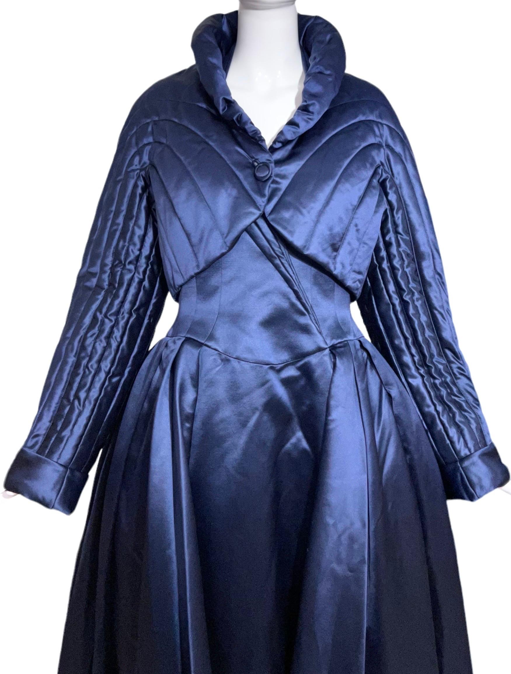 Thierry Mugler Haute Couture extravagant dramatic ballgown and matching jacket ensemble set in a rich midnight blue color. This avant-garde ensemble includes a regal pleated ballgown with incredible draping that features a train, halter neck, open