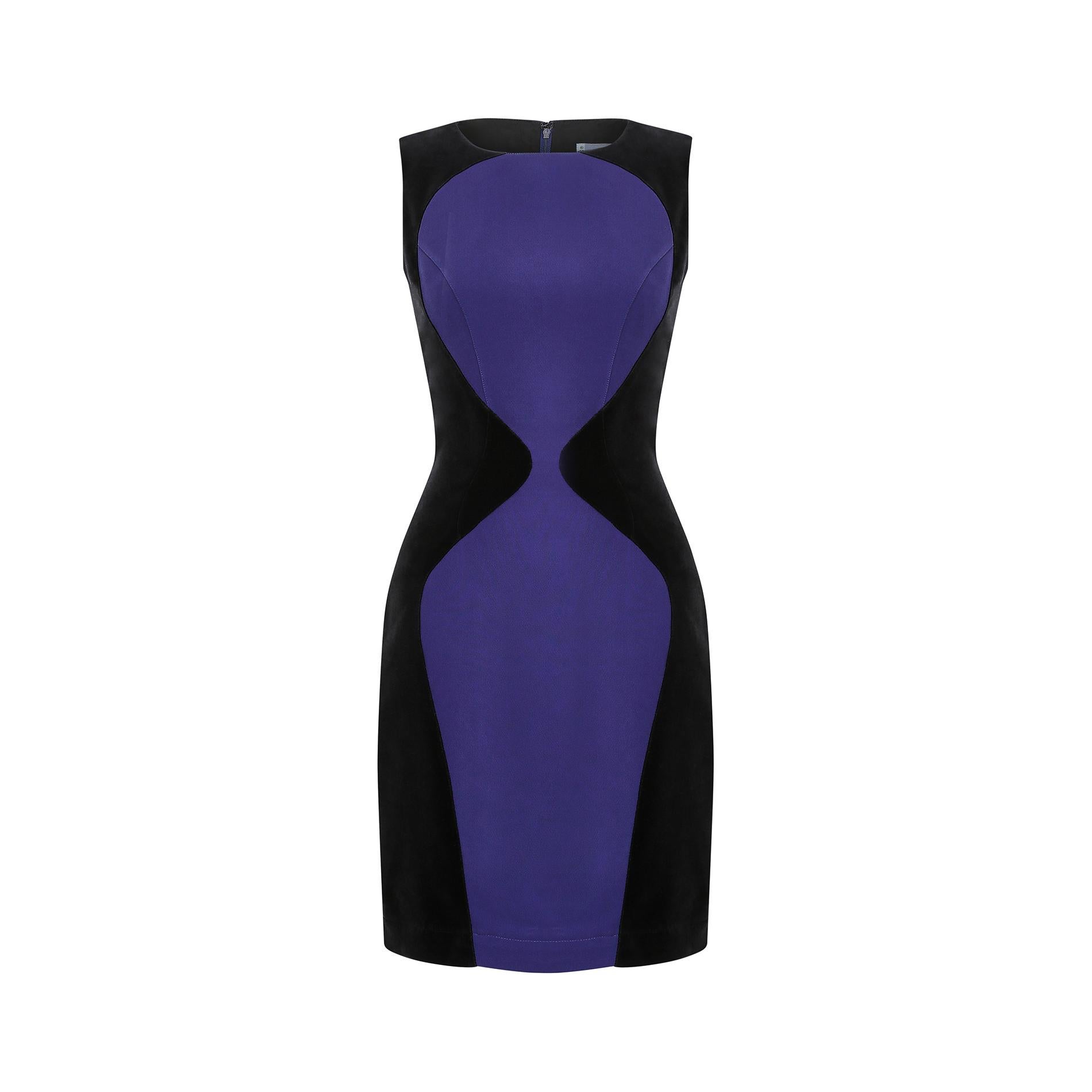 This incredible 1990s Mugler dress creates the most flattering and feminine silhouette for the wearer. Made from thick black velvet with indigo blue, almost purple fabric panelling, its tailoring creates a beautiful hourglass illusion. The front