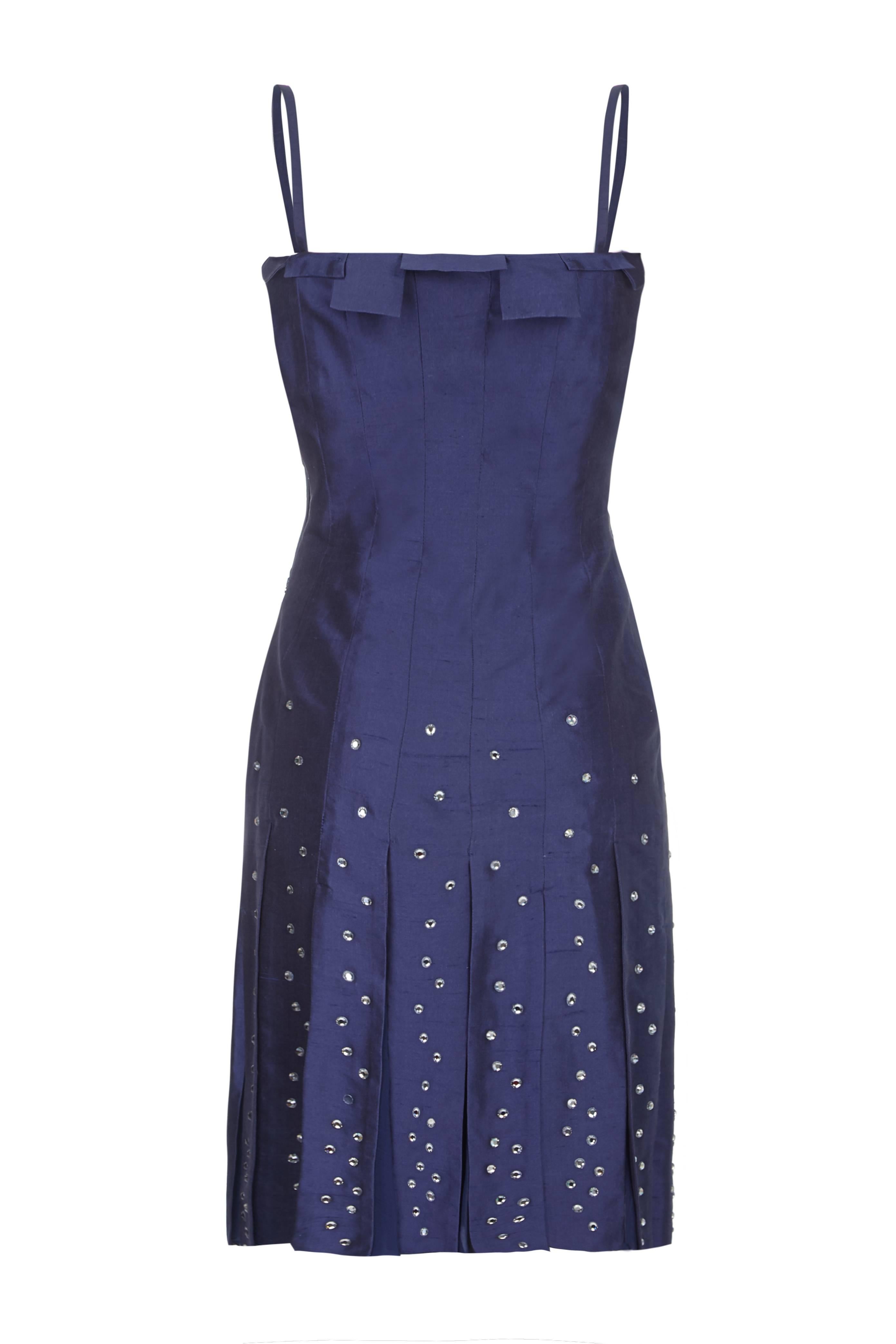 This absolutely stunning vintage couture Thierry Mugler cocktail dress from the early 90s in midnight blue silk is beautifully made and in very good vintage condition with gentle signs of use. The dress exemplifies the designers innovative approach