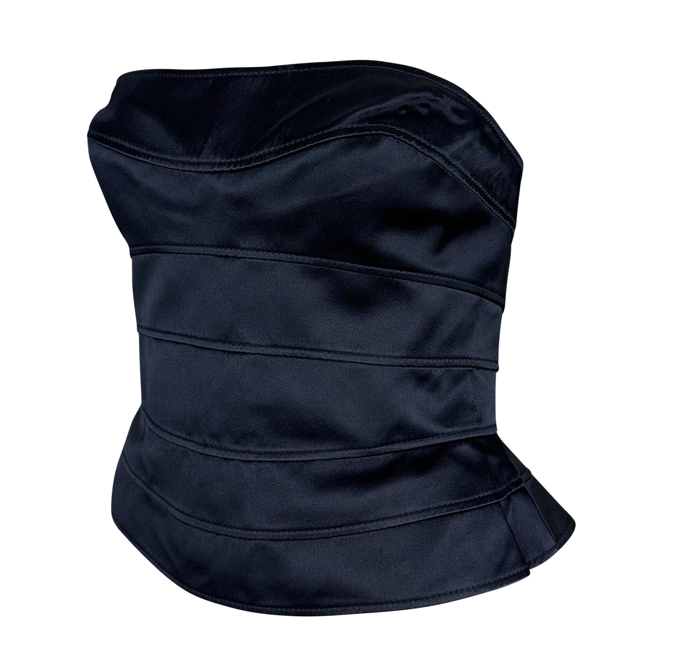 Presenting a fabulous black silk satin Thierry Mugler strapless corset top designed by Manfred Mugler. From the 1990s, this stunning top is constructed entirely of horizontal navy silk satin panels. This Thierry Mugler creation perfectly accentuates