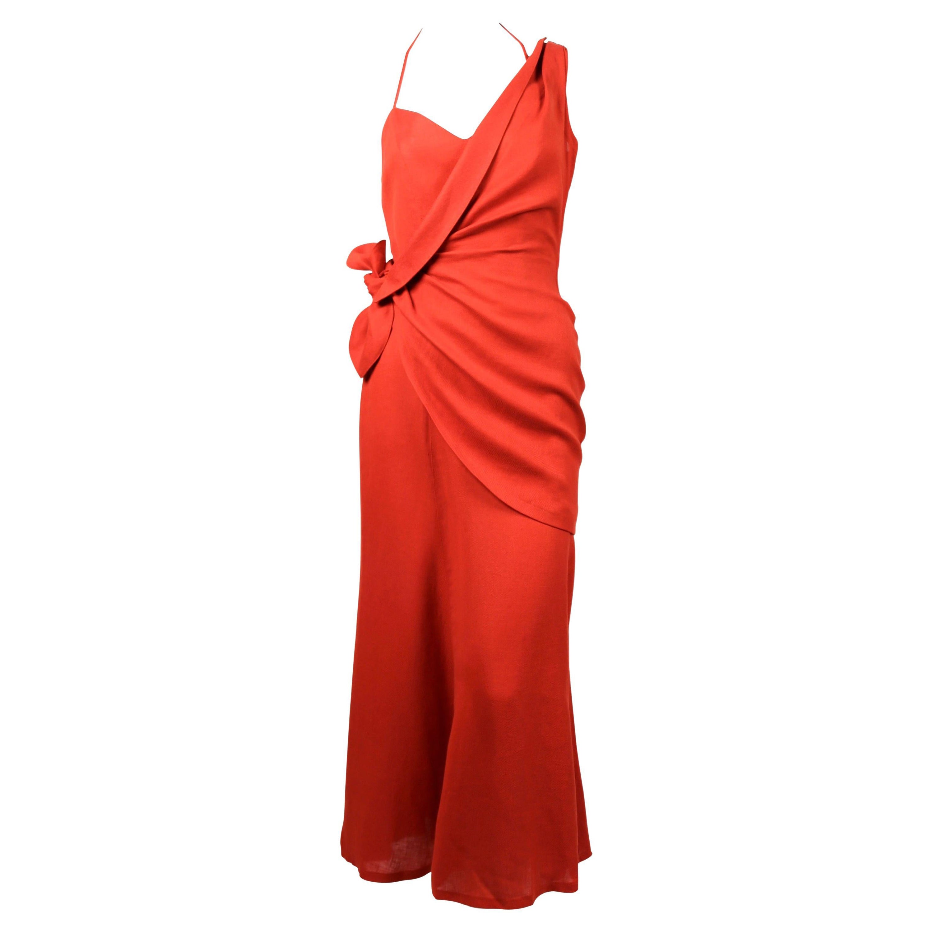 Stunning, persimmon colored linen dress with asymmetrical wrap designed by Thierry Mugler dating to the 1990's. French size 36. Approximate measurements: bust 32-33
