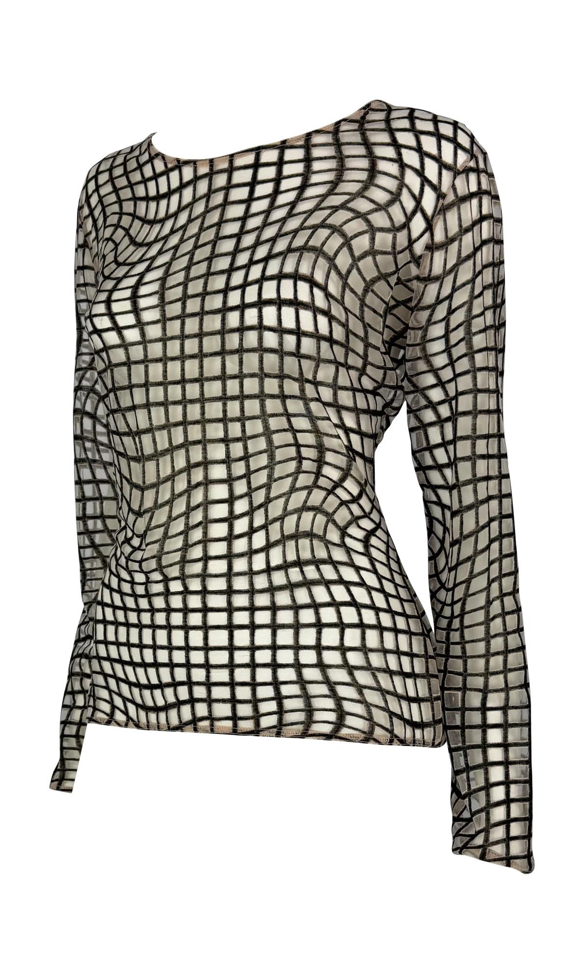 This 1990s Thierry Mugler top designed by Manfred Mugler features a sheer beige fabric with an op-art grid print in black. The long-sleeve design offers a slim silhouette, showcasing Mugler's mastery of bold, graphic patterns.

Approximate