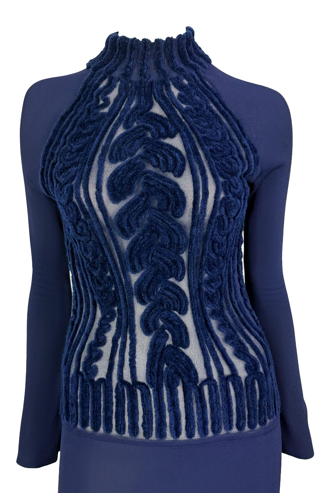 Presenting a stunning navy blue knit Thierry Mugler long-sleeve gown, designed by Manfred Mugler. From the Mid-1990s, this knit bodycon dress features a mock neck and stands out with a sheer torso with a scrolling velvet devoré pattern creating a