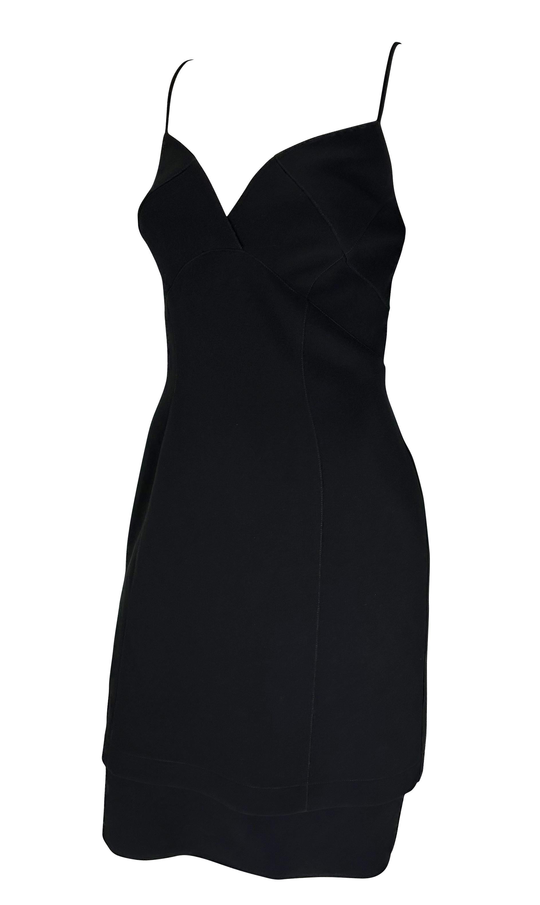 Presenting a beautiful black Thierry Mugler cocktail dress designed by Manfred Mugler. This simple and oh-so-sexy dress features a sweetheart neckline, spaghetti straps, and a layered hem. The perfect little Thierry Mugler black dress, this