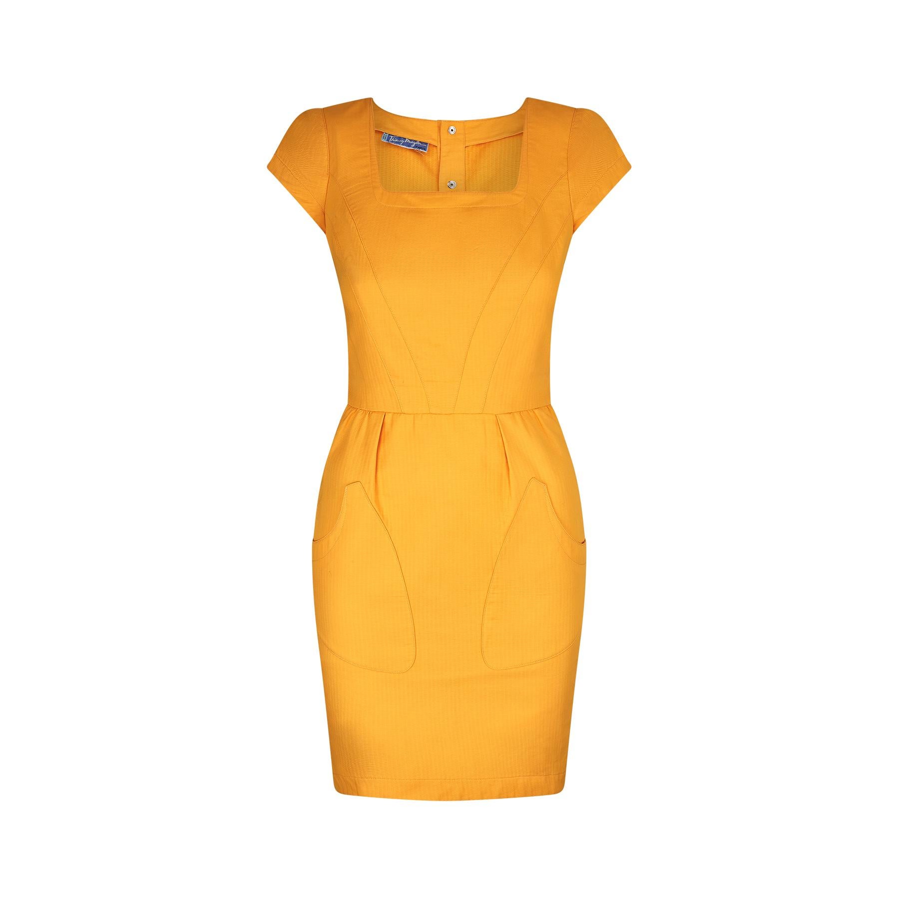 This is such a great fitted example of Thierry Mugler’s genius with superb and complex construction details from the cap sleeves through to the V panelled and shaped bodice. The skirt has wide, flamboyant front facing pockets on the fitted tulip