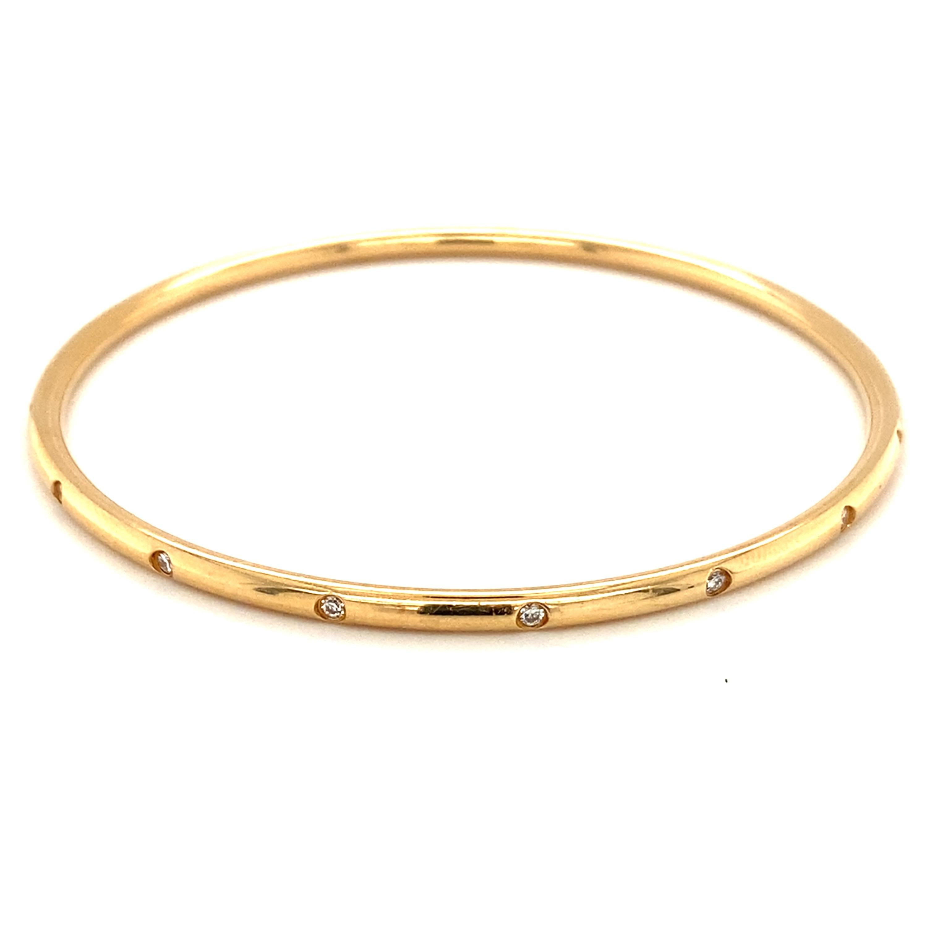 Item Details: 
Tiffany & Co Diamond Bangle
Metal Type: 18 Karat Yellow Gold
Weight: 20 grams

Diamond Details:
Cut: Round
Carat: 0.16 Carats total weight
Color: G
Clarity: VS

Item Features:
This elegant Tiffany & Co. bangle features 0.16 carat