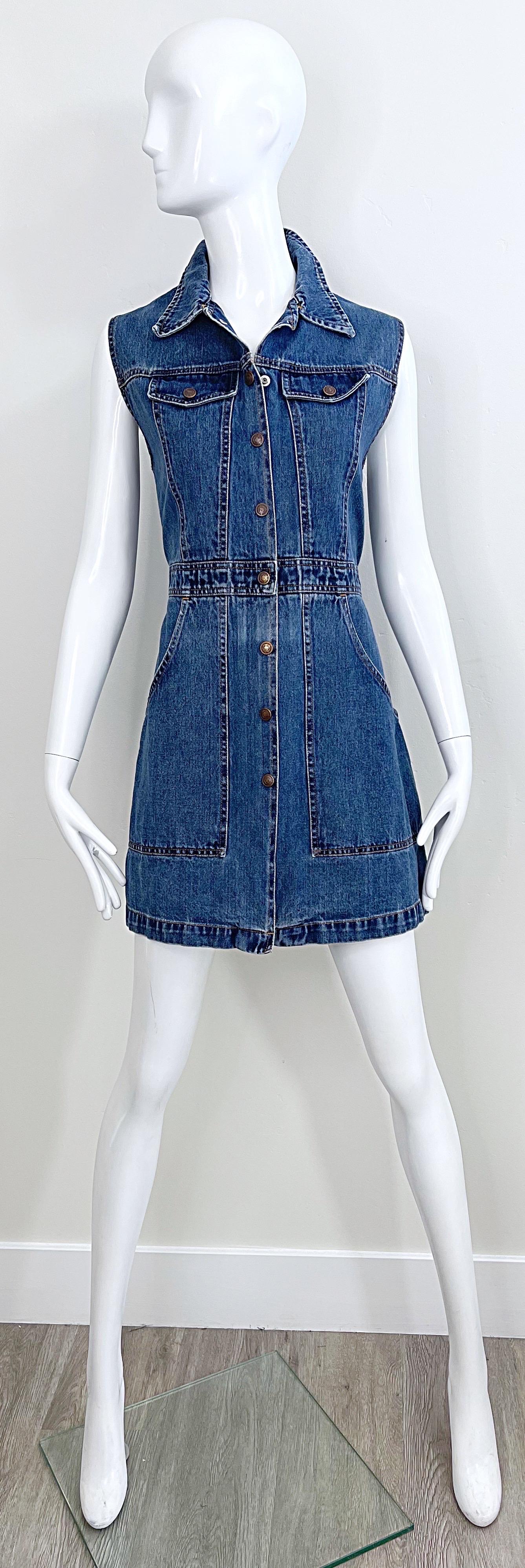 Chic vintage 90s TODD OLDHAM blue jean / denim sleeveless dress ! Buttons up the front, with pockets at each side of the waist. 
In great condition
Made in USA
Marked Size Large
Measurements:
38 inch bust
34 inch waist
42 inch hips
32.5 inches from