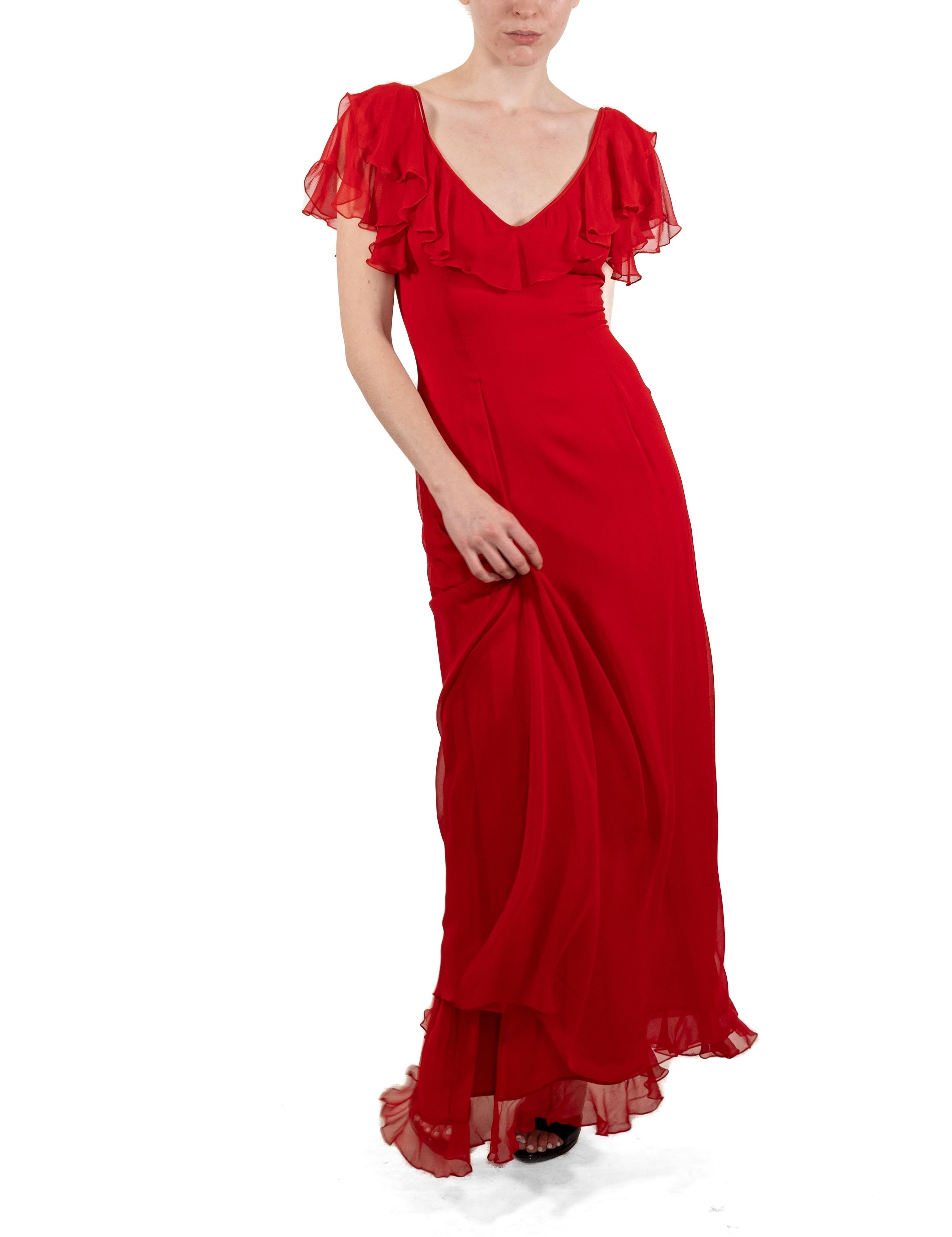 This gown retains no label, however the amount of hand-finishing points to Haute Couture or custom made quality, fully lined in silk. 1990S Tomato Red Silk Chiffon Ruffled Gown 