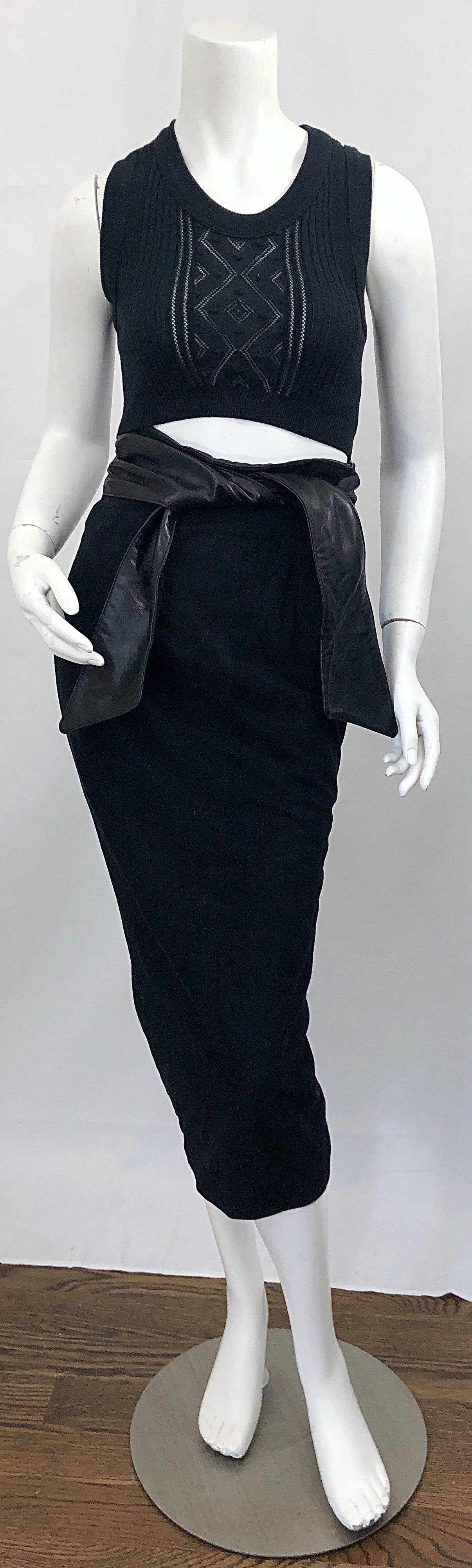 Chic 1990s VAKKO Size 4 black suede and leather high waisted belted pencil midi skirt! Wonderful form fitting silhouette, with attached black leather tie sash belt. Hidden zipper up the back with hook-and-eye closure. Fully lined. The pictured