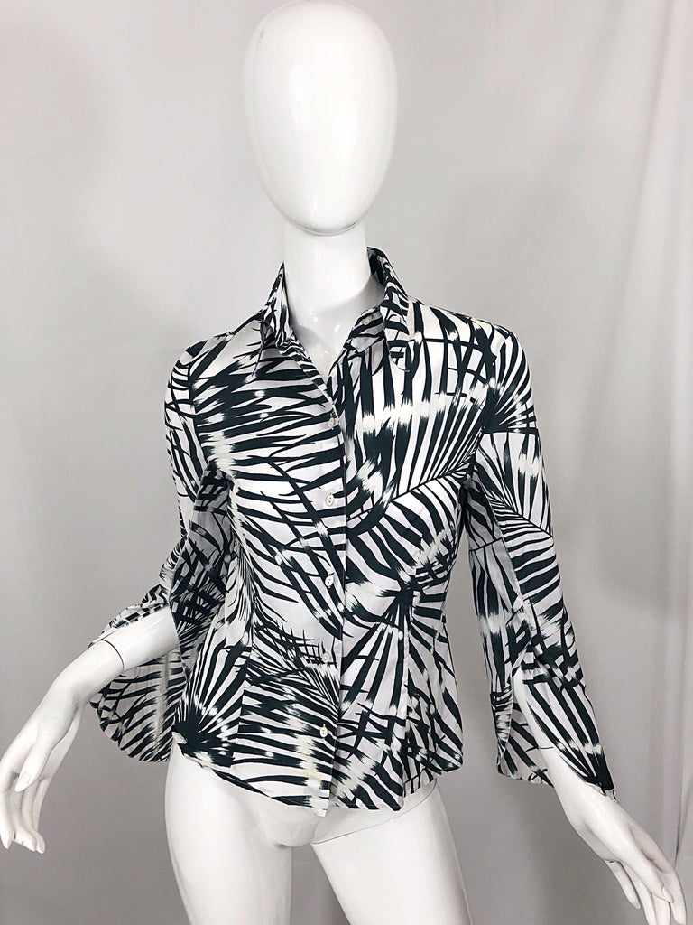 Chic late 90s vintage VALENTINO black and white soft cotton button up long bell sleeve blouse! Features a unique tropical palm leave print throughout. Slashed bell sleeves offer just the right amount of flare. Buttons up the front. Can easily be