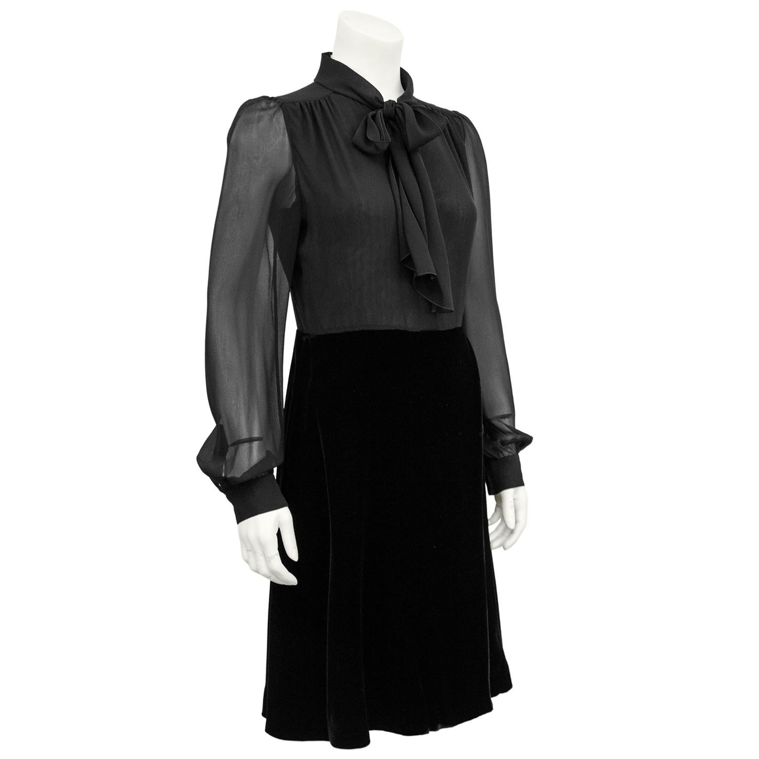 Amazing 1990s Valentino little black shirt dress from Holt Renfrew Canada. Top is black chiffon with a pussy bow tie, sheer bishop sleeves and delicate ruching at shoulders. Jet black a line wrap style velvet skirt with a panel of black chiffon that