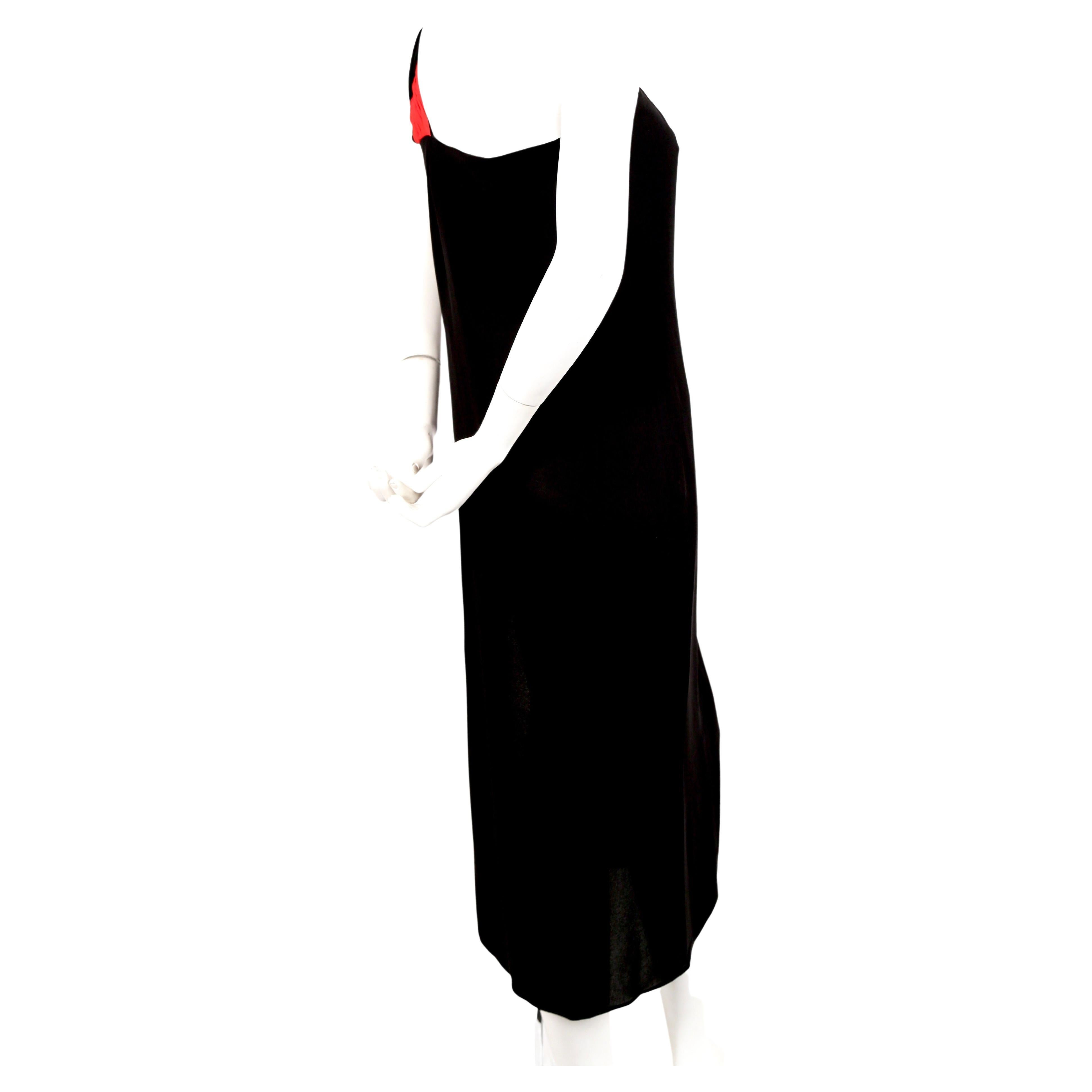 Grecian, jet-black silk dress with red pleated single shoulder from Valentino dating to the 1990's. No size is indicated however this would best fit a US 4 or French 36 or 38. Dress has an internal boned corset. Approximate measurements: bust
