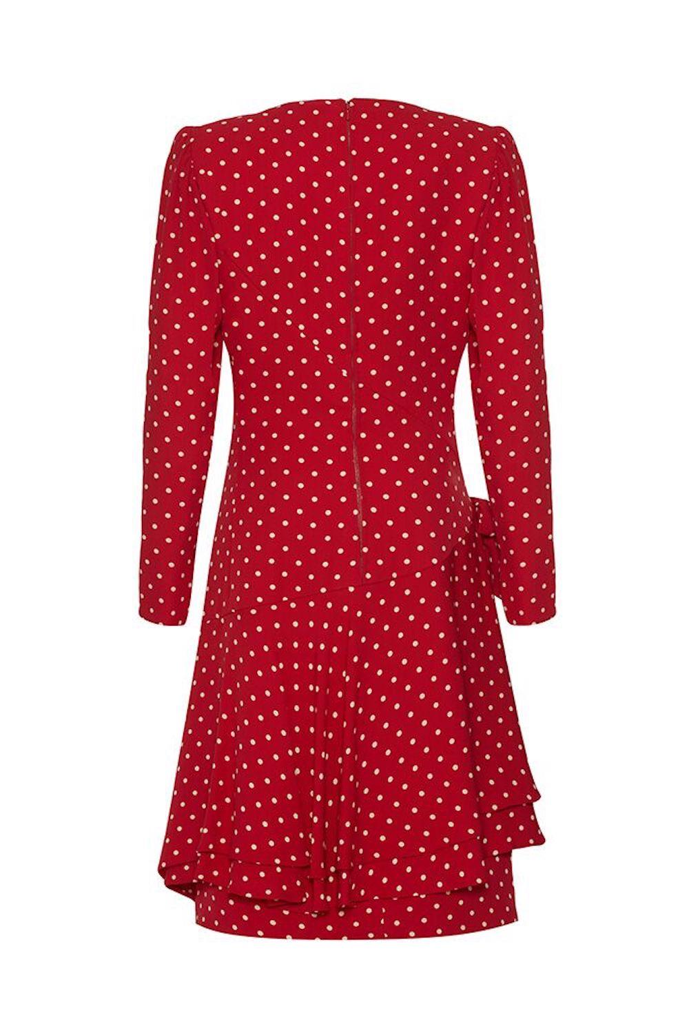 This sensational 1990s silk crepe red and white polka dot demi-couture dress is by extolled Italian designer Valentino and has superb construction with some beautifully detailed design features. The fabric is assembled into triangulated panels which